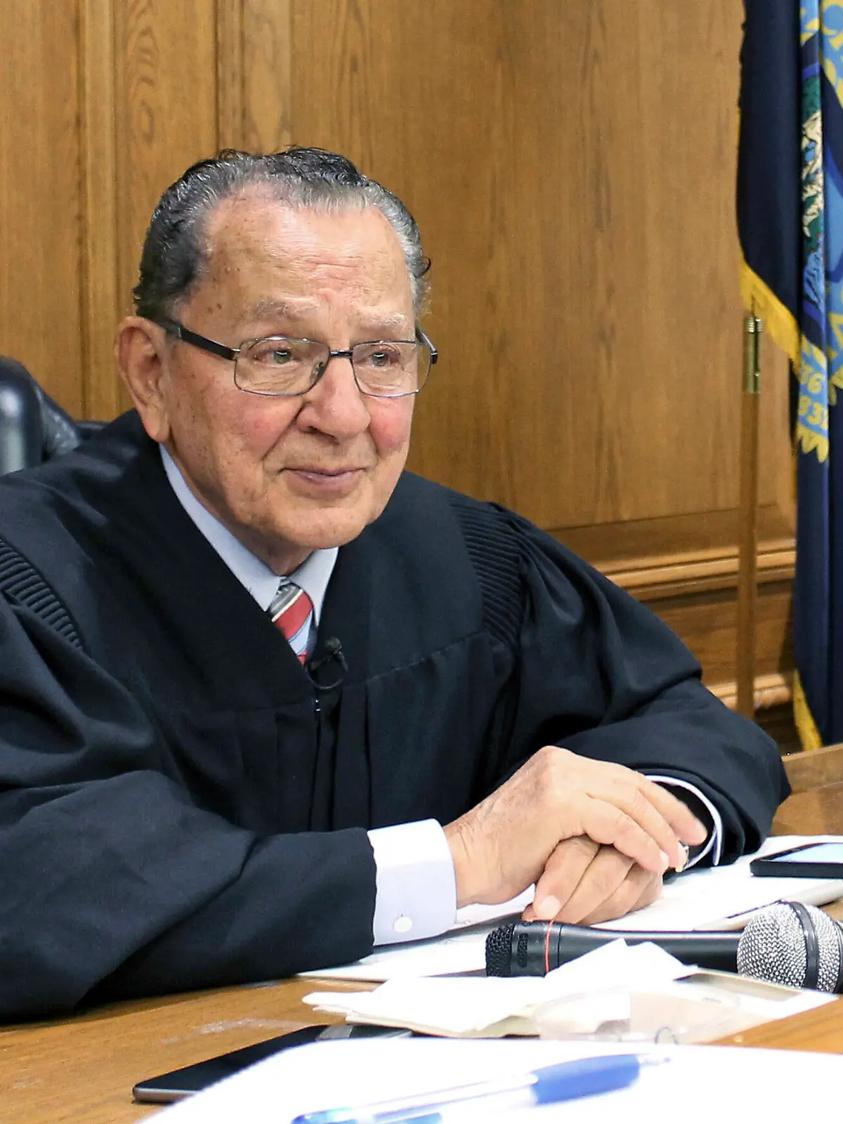 FILE - In this Aug. 10, 2017 file photo, Providence Municipal Court Judge Frank Caprio sits on the bench in Providence, R.I. The television program featuring the 81-year-old judge, who made a splash on social media, is going national. The producers of the local show "Caught in Providence" have struck a deal with FOX Television Stations to air the show in major media markets starting in the fall of 2018. (AP Photo/Michelle R. Smith, File)