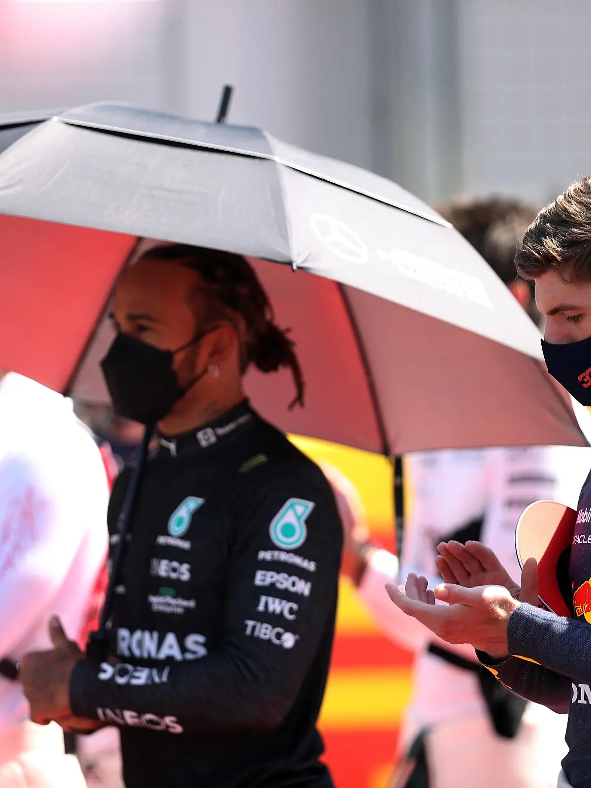 Formula One F1 - British Grand Prix - Silverstone Circuit, Silverstone, Britain - July 18, 2021 Mercedes' Lewis Hamilton and Red Bull's Max Verstappen before the race Pool via REUTERS/Lars Baron