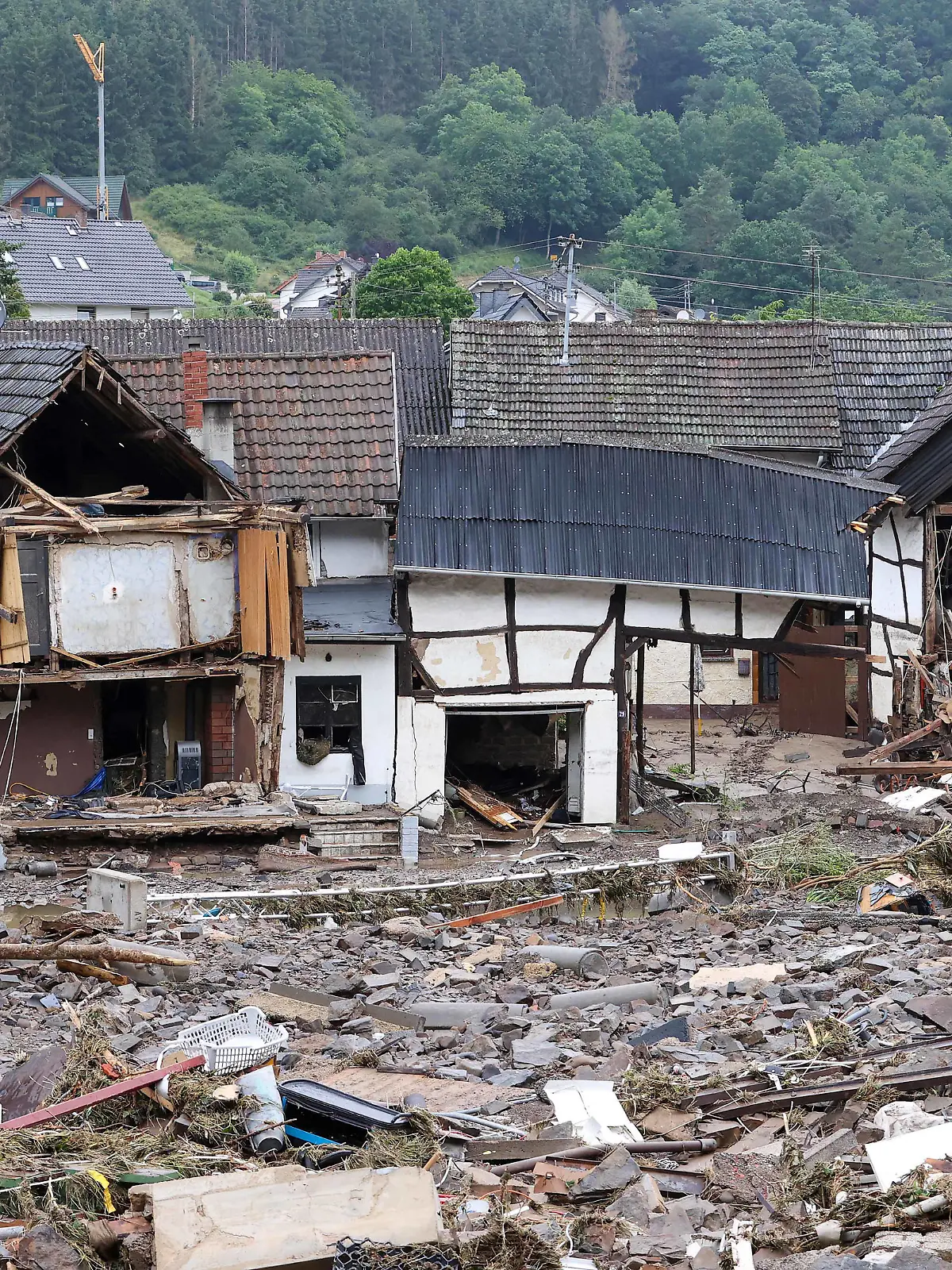  210716 -- AHRWEILER, July 16, 2021 -- Photo taken on July 16, 2021 shows roads and houses damaged in flood disaster in Schuld, a town in Ahrweiler, Germany. The death toll from the flood disaster triggered by heavy rainfall in western and southern Germany has risen to more than 100 as of Friday noon local time, according to police and local authorities. Photo by /Xinhua GERMANY-AHRWEILER-FLOODS JoachimxBywaletz PUBLICATIONxNOTxINxCHN
