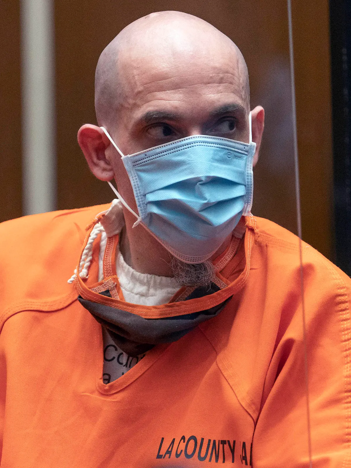 Serial killer Michael Thomas Gargiulo listens to Michael Ellerin, the father of victim Ashley Ellerin, a 22-year-old fashion design student, during a victim's statement at Gargiulo's sentencing hearing at Los Angeles Superior Court, Friday, July 16, 2021. For crimes he called “vicious and frightening,” a judge on Friday gave a death sentence to Gargiulo, a man prosecutors called “The Boy Next Door Killer” for the home-invasion murders of two women and the attempted murder of a third.  (AP Photo/Damian Dovarganes)