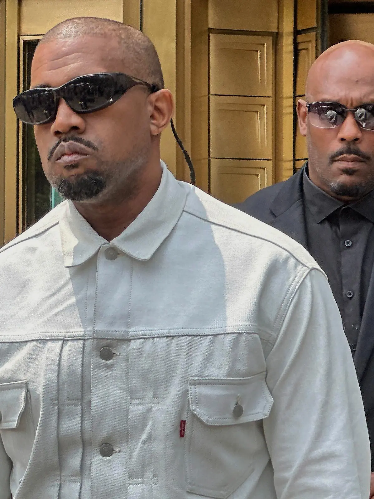 Ye, the rapper formerly known as Kanye West, leaves federal court during the trial of Sean "Diddy" Combs in New York, Friday, June 13, 2025. (AP Photo/Michael R. Sisak)