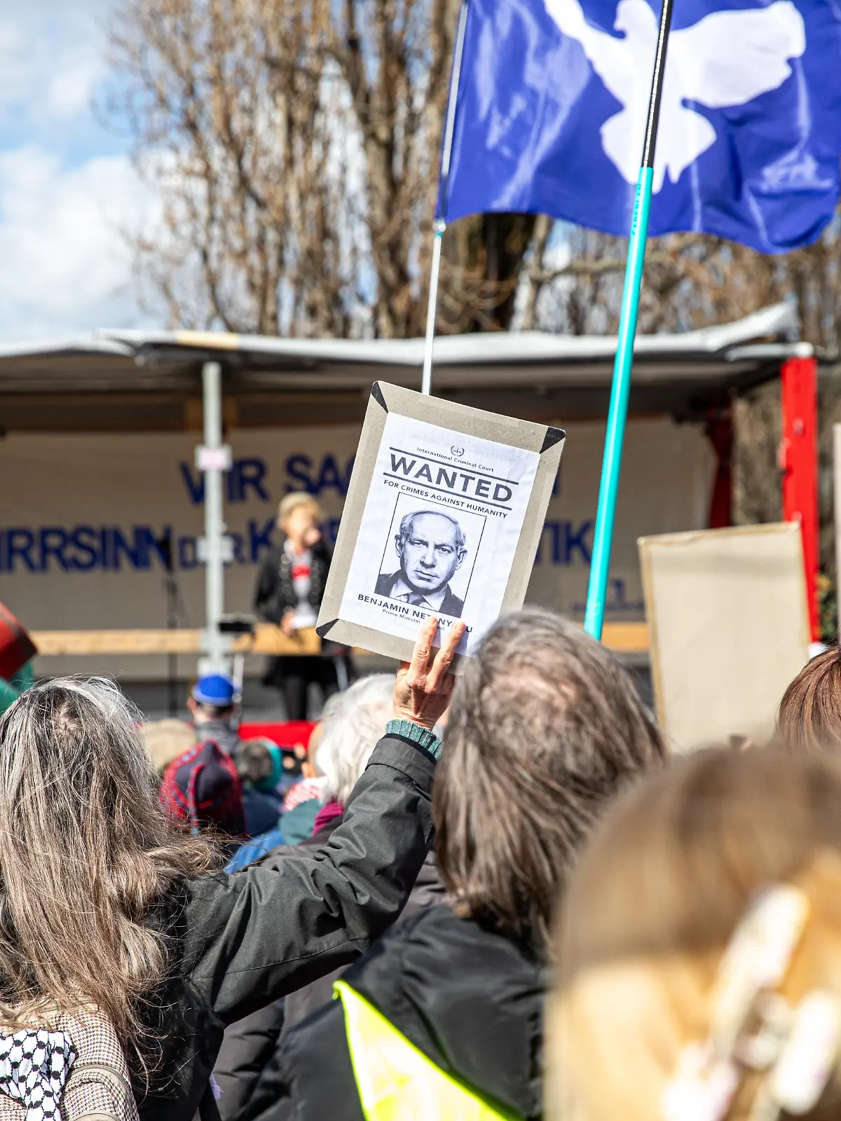 On Saturday, April 4, 2026, demonstrators gathered at Mauerpark in Berlin for an Easter peace march, where speakers and participants called for an end to military escalation and international conflicts. Protesters held signs opposing U.S. President Donald Trump, German Chancellor Friedrich Merz and Israeli Prime Minister Benjamin Netanyahu, while calling for peace and an end to what they described as war and aggression. During speeches, participants urged the closure of U.S. military bases in Germany, including Ramstein Air Base, and criticized NATO policies and increased defense spending. Demonstrators carried a range of banners and flags, including Palestinian flags, Iranian flags, and peace flags featuring dove symbols. Some signs called for an end to what protesters described as war drivers, while others expressed opposition to U.S. and Israeli military actions and showed solidarity with Russia. A Statue of Liberty prop covered in red paint and holding an oil barrel is seen among the crowd. Additional banners criticized NATO and called for diplomatic solutions instead of continued military support in ongoing conflicts. (Photo by Michael Kuenne/PRESSCOV/Sipa USA)