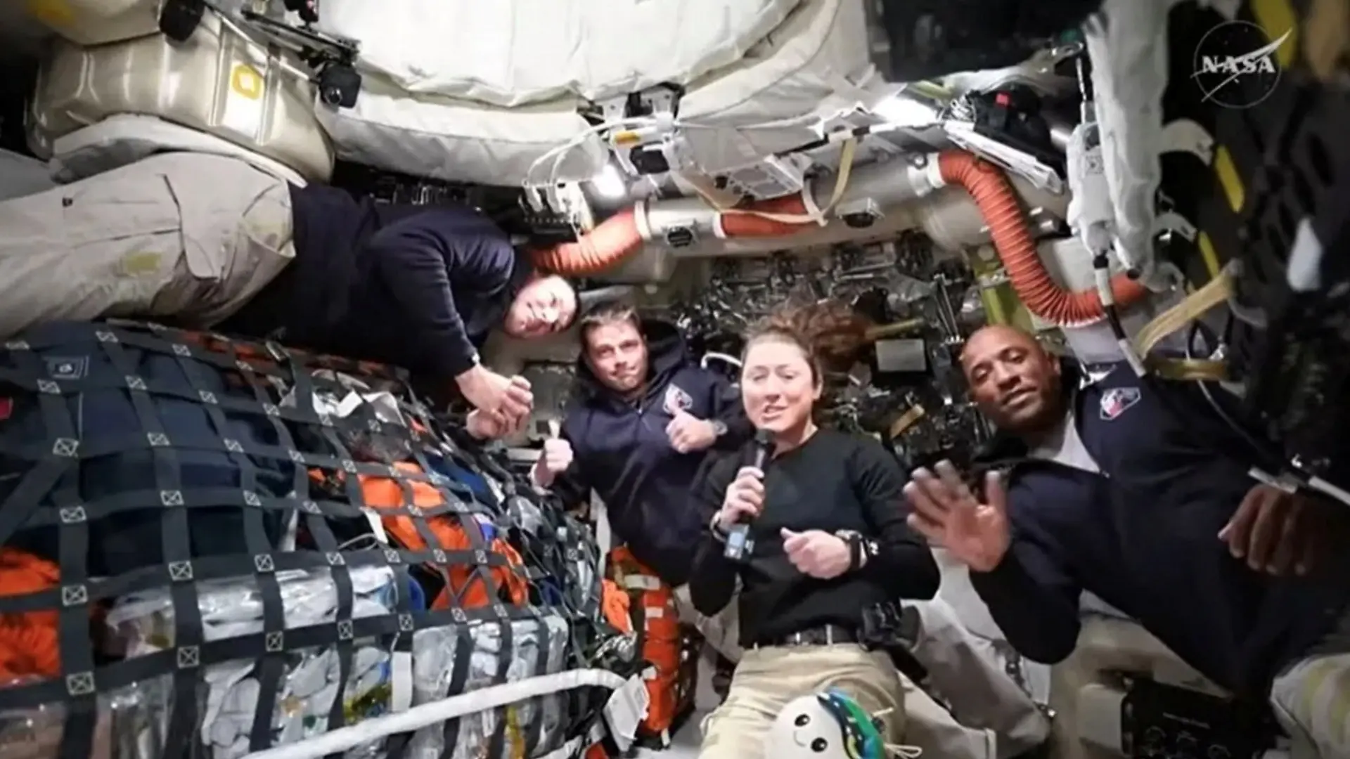 NASA Artemis II crew members Jeremy Hansen, Reid Wiseman, Christina Koch, and Victor Glover answer questions from reporters