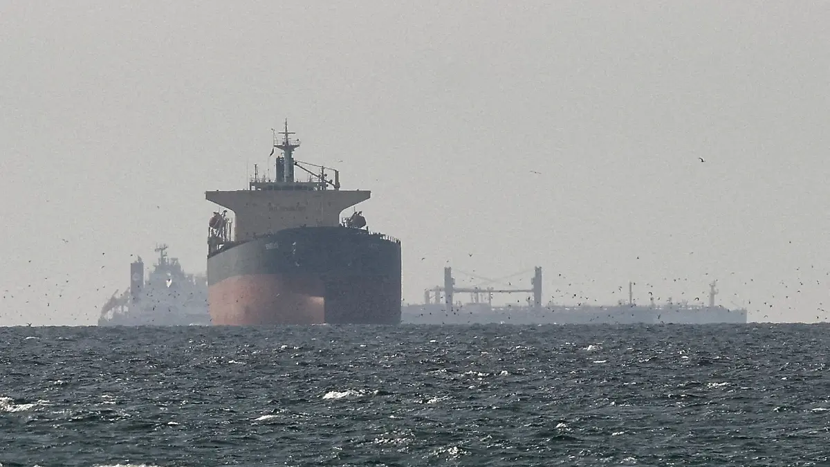 FILE PHOTO: Cargo ships in the Gulf, near the Strait of Hormuz, as seen from northern Ras al-Khaimah, near the border with Oman’s Musandam governance, amid the U.S.-Israeli conflict with Iran, in United Arab Emirates, March 11, 2026. REUTERS/Stringer/File Photo/File Photo