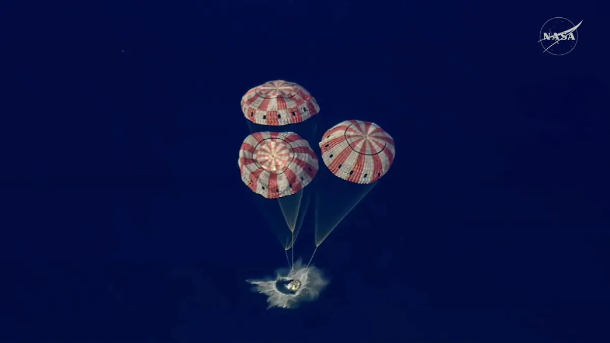 In this image from video provided by NASA, the Artemis II Orion capsule splashes down in the Pacific Ocean, on Friday, April 10, 2026. (NASA via AP)