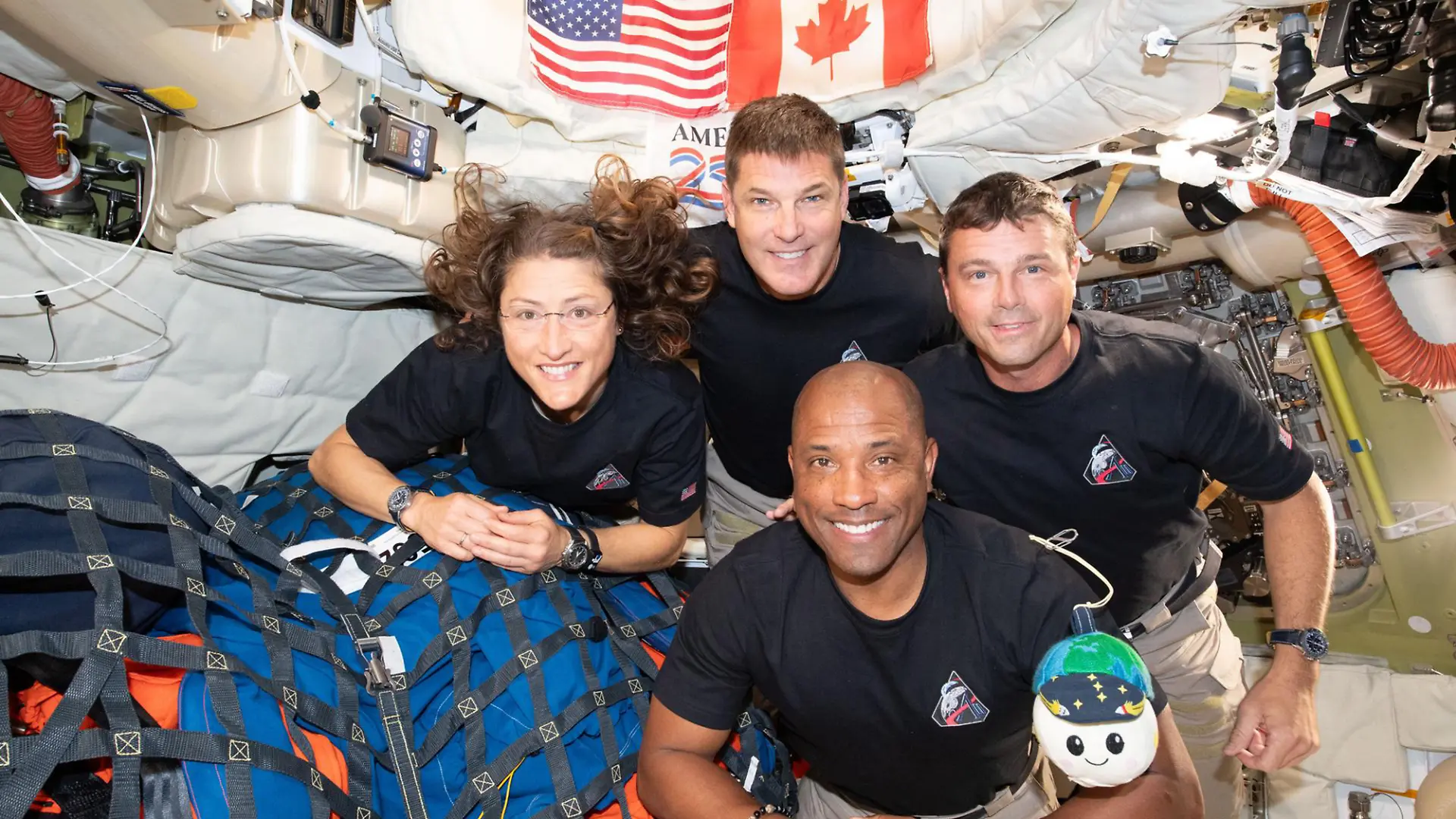 The Artemis II crew (clockwise from left) Mission Specialist Christina Koch, Mission Specialist Jeremy Hansen, Commander Reid Wiseman, and Pilot Victor Glover pause for a group photo with their zero gravity indicator "Rise," inside the Orion spacecraft on their way home. Following a swing around the far side of the Moon on April 6, 2026, the crew exited the lunar sphere of influence (the point at which the Moon's gravity has a stronger pull on Orion than the Earth's) on April 7, and are headed back to Earth for a splashdown in the Pacific Ocean on April 10. NASA/UPI Photo via Newscom picture alliance