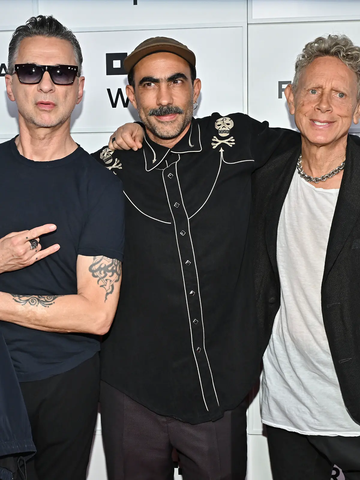 Dave Gahan, left, Fernando Frias and Martin Gore attend the "Depeche Mode: M" premiere at BMCC Tribeca Performing Arts Center during the Tribeca Festival on Thursday, June 5, 2025, in New York. (Photo by Evan Agostini/Invision/AP)