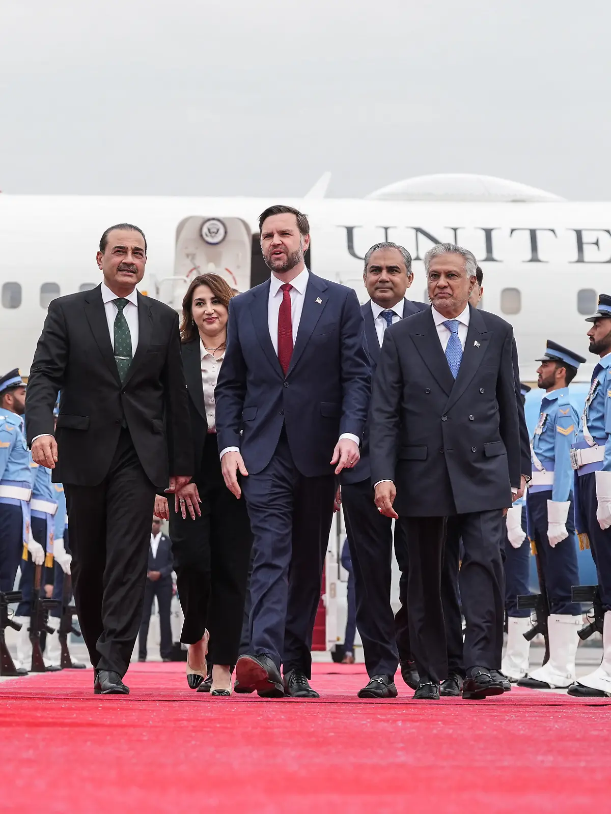 US Vice President JD Vance (C) speaks with Army Chief and Field Marshal Syed Asim Munir (L) and Pakistan's Foreign Minister Ishaq Dar (R) after arriving for the US-Iran peace talks in Islamabad on April 11, 2026. US Vice President JD Vance arrived in Islamabad on April 11 for talks with Iran that the Pakistani premier hosting the warring sides called a "make or break" effort to permanently halt weeks of fighting in the Middle East. (Photo by Jacquelyn MARTIN / POOL / AFP)