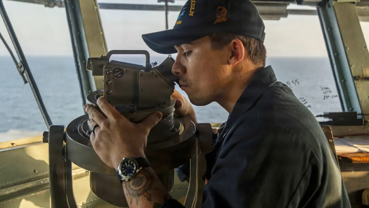 This image provided by U.S. Central Command shows a Navy sailor standing watch on the bridge of the USS Abraham Lincoln (CVN 72) in support of Operation Epic Fury on Sunday, March 1, 2026. (U.S. Navy via AP)