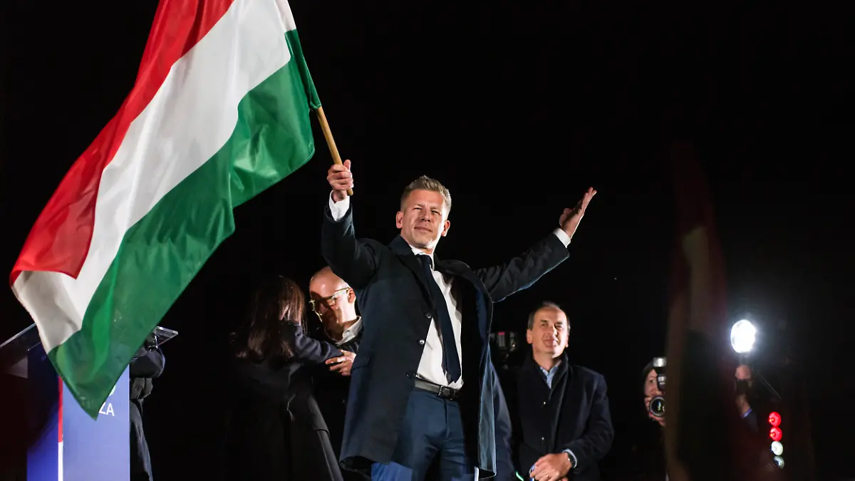April 13, 2026, Budapest, Hungary: Peter Magyar waves the Hungarian flag after his speech during the TISZA party's election night event in Budapest. April 12, 2026, marked the most significant political transformation in Hungary in decades. The election night for Peter Magyar's TISZA party in Budapest saw thousands of citizens gathering to celebrate a decisive victory over Prime Minister Viktor Orbánâs Fidesz party, which had been in power since 2010..Péter Magyar, who emerged as a central opposition figure only two years ago, successfully mobilized a record number of voters by focusing his campaign on anti-corruption measures, improving living standards, and restoring Hungary's pro-European course. (Credit Image: © Attila Husejnow/SOPA Images via ZUMA Press Wire