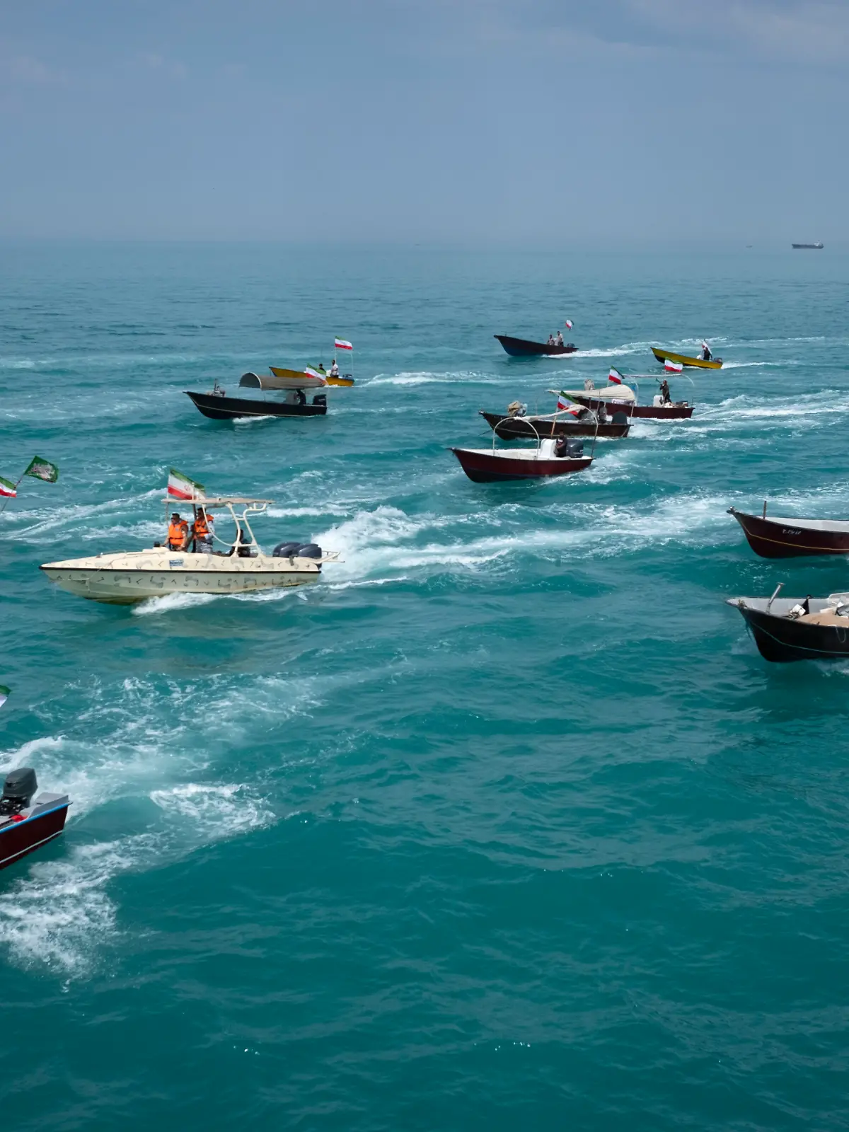 Basij paramilitary force speed boats are sailing along the Persian Gulf during the Islamic Revolutionary Guard Corps (IRGC) marine parade to commemorate Persian Gulf National Day, near the Bushehr nuclear power plant in the seaport city of Bushehr, Bushehr province, in the south of Iran, on April 29, 2024. Persian Gulf National Day, which celebrates the expulsion of the Portuguese from the Strait of Hormuz and the Persian Gulf in 1622 by the Safavid forces led by Imam Quli Khan under the command of Shah Abbas I, is observed on the 10th of Ordibehesht in the Iranian calendar, typically falling in late April or early May. (Photo by Morteza Nikoubazl/NurPhoto)