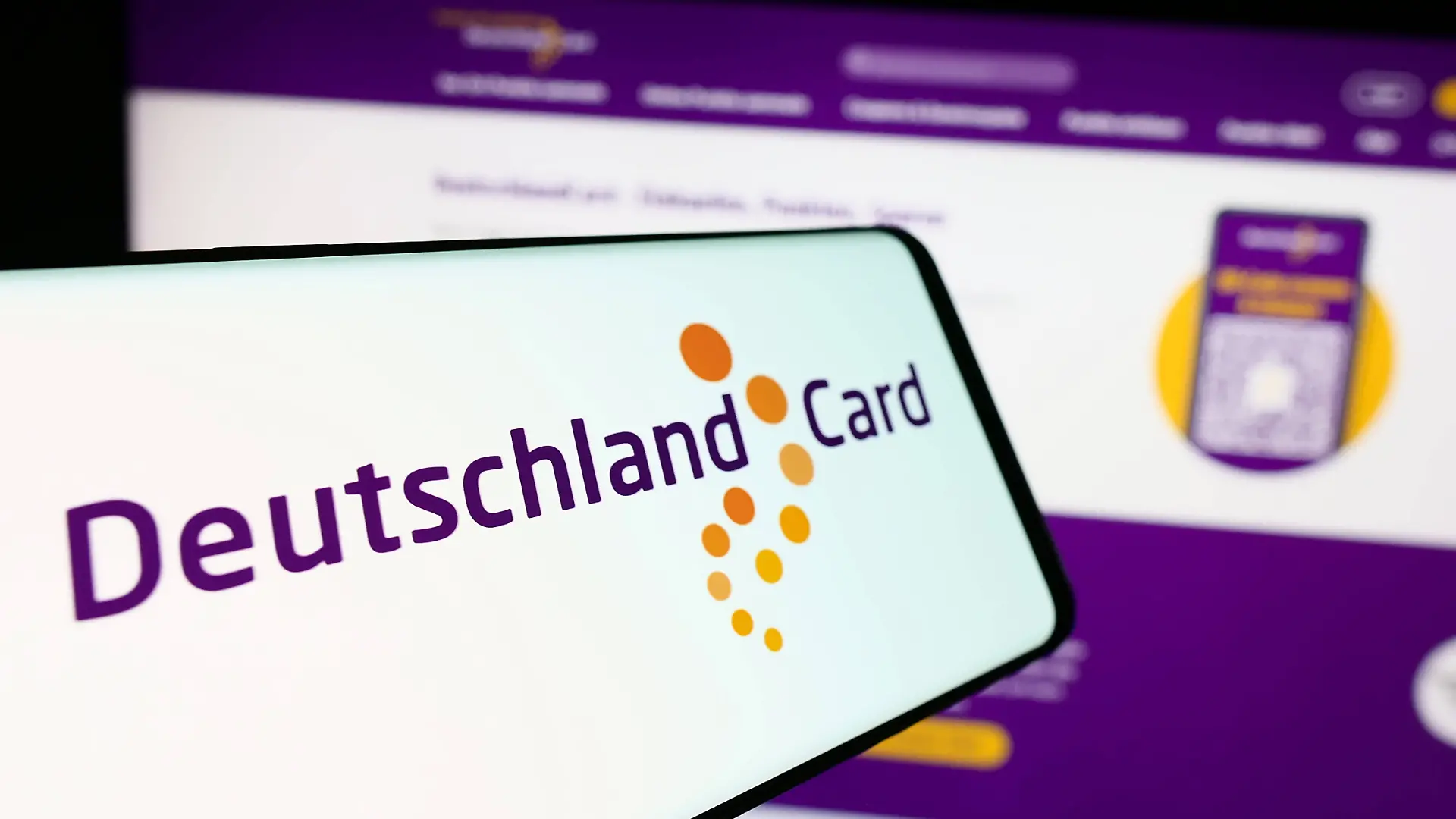 Cellphone with logo of German customer loyalty company DeutschlandCard GmbH in front of website. Stuttgart, Germany - 07-15-2024: Cellphone with logo of German customer loyalty company DeutschlandCard GmbH in front of business website. Focus on center of phone display. Copyright: xZoonar.com/TimonxSchneiderx 22091018