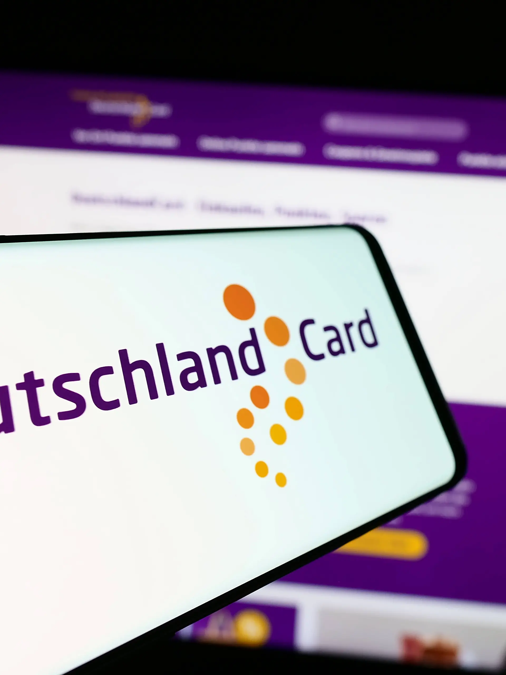 Cellphone with logo of German customer loyalty company DeutschlandCard GmbH in front of website. Stuttgart, Germany - 07-15-2024: Cellphone with logo of German customer loyalty company DeutschlandCard GmbH in front of business website. Focus on center of phone display. Copyright: xZoonar.com/TimonxSchneiderx 22091018