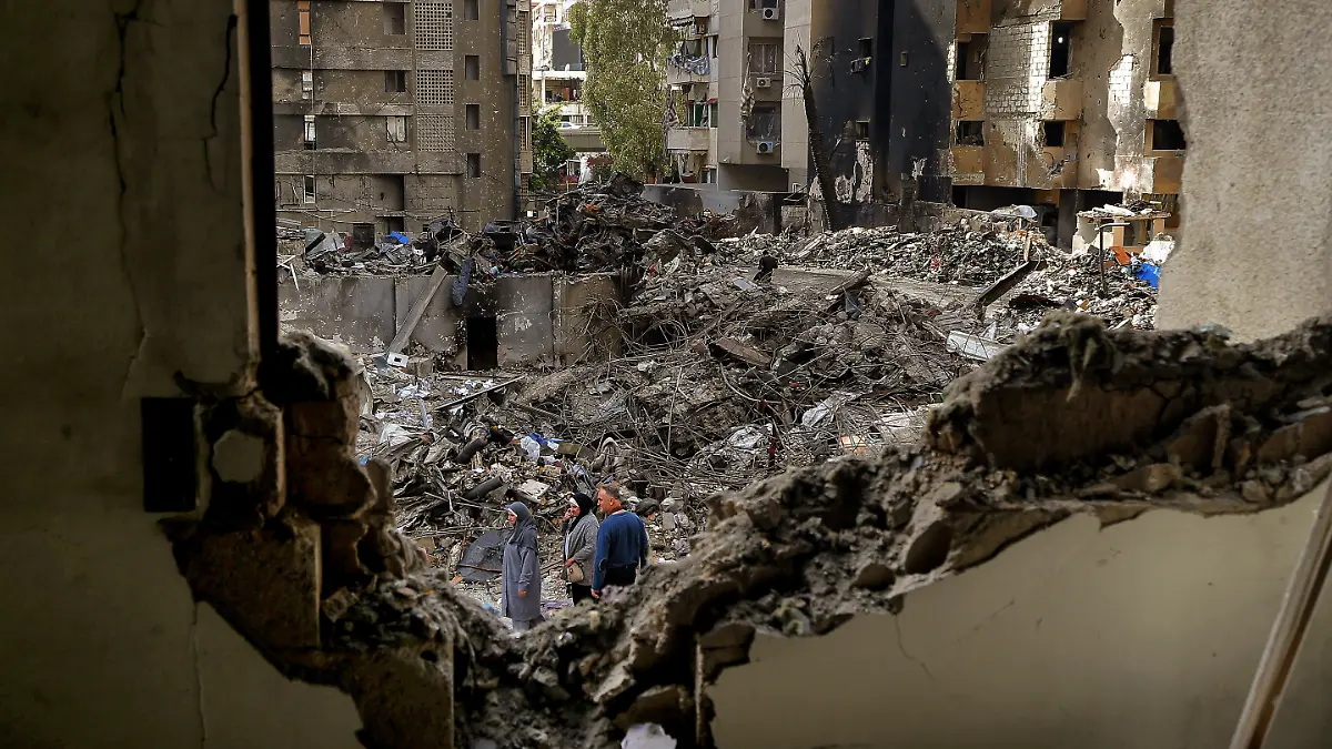 April 14, 2026, Beirut, Beirut, Lebanon: Lebanese women walk among destruction caused by Israeli air strikes on Beirut. Lebanon and Israel are holding their first direct diplomatic talks in more than 30 years. The talks are aimed at preparing negotiations to resolve Israel's conflict with pro-Iranian Hezbollah. Hezbollah leader Naim Qassem urged Lebanon to cancel the planned meeting with Israel, reiterating his group's rejection of direct negotiations with its foe. (Credit Image: Â© Marwan Naamani/ZUMA Press Wire