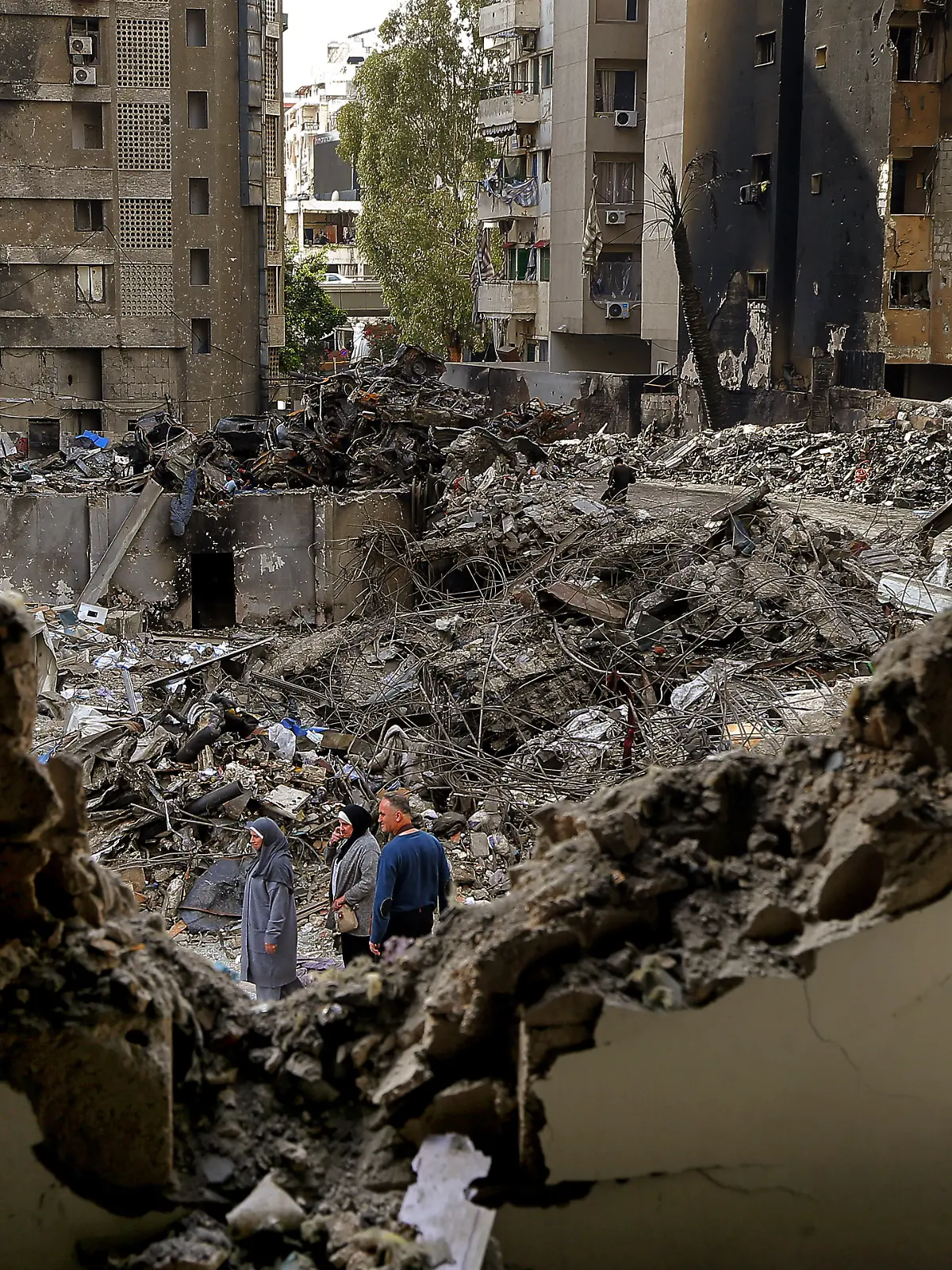 April 14, 2026, Beirut, Beirut, Lebanon: Lebanese women walk among destruction caused by Israeli air strikes on Beirut. Lebanon and Israel are holding their first direct diplomatic talks in more than 30 years. The talks are aimed at preparing negotiations to resolve Israel's conflict with pro-Iranian Hezbollah. Hezbollah leader Naim Qassem urged Lebanon to cancel the planned meeting with Israel, reiterating his group's rejection of direct negotiations with its foe. (Credit Image: © Marwan Naamani/ZUMA Press Wire