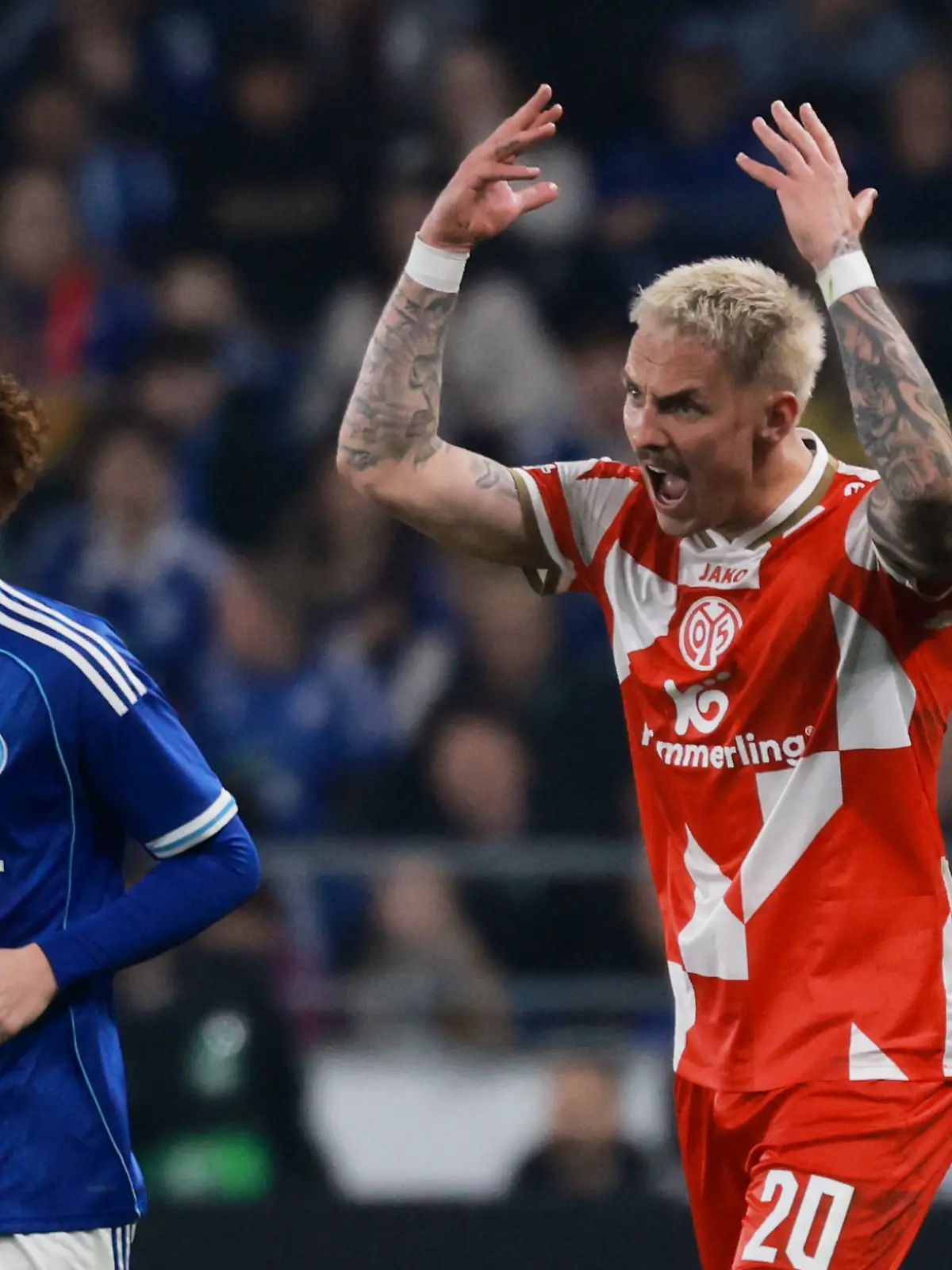 Soccer Football - UEFA Conference League - Quarter Final - Second Leg - RC Strasbourg v 1. FSV Mainz 05 - Stade de la Meinau, Strasbourg, France - April 16, 2026  1. FSV Mainz 05's Phillip Tietz and RC Strasbourg's Valentin Barco react REUTERS/Stephanie Lecocq