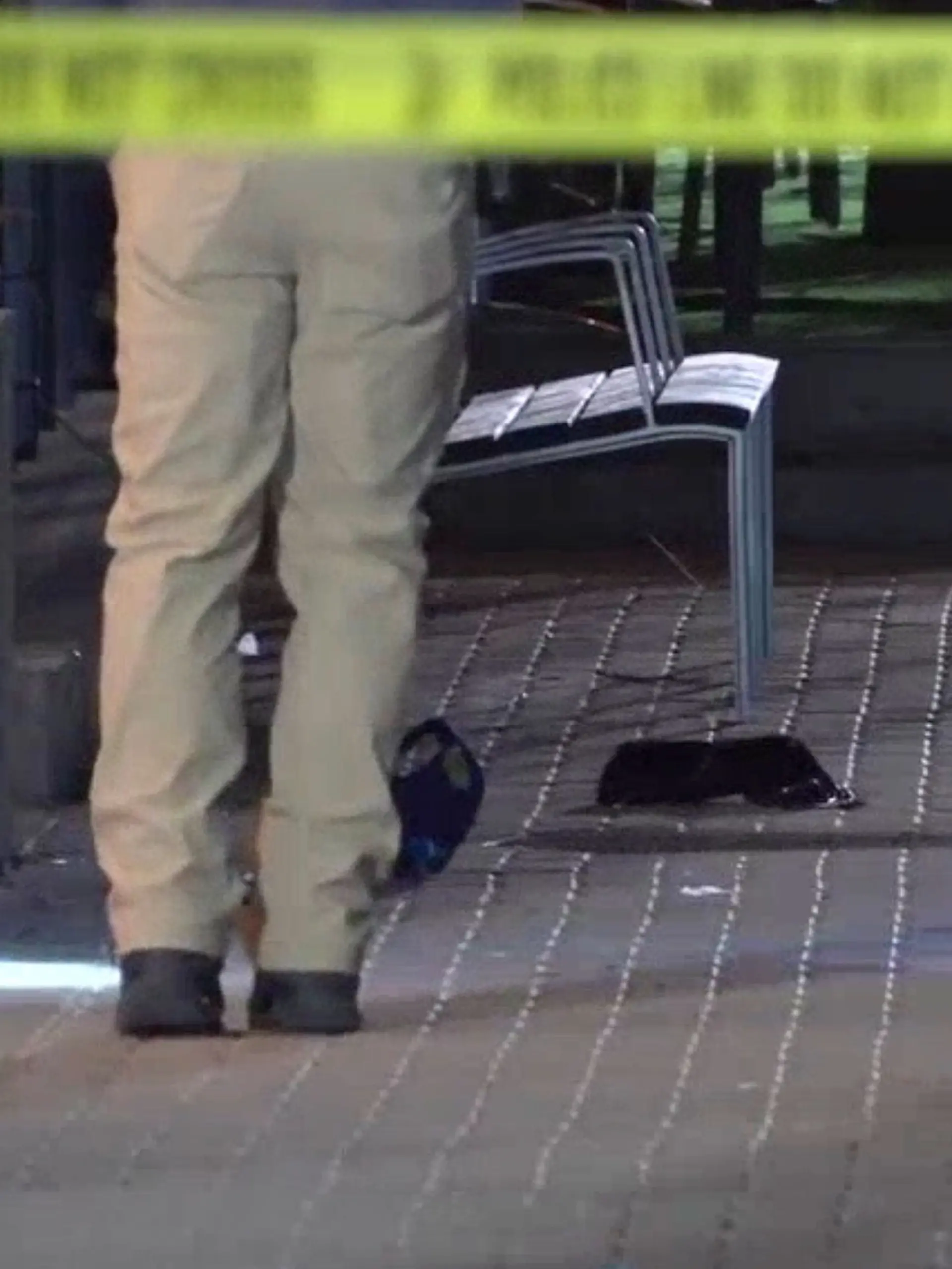 This image made from video provided by KCRG shows Iowa City police officers working the scene of a downtown shooting near the University of Iowa campus on Sunday, April 19, 2026. (KCRG via AP)