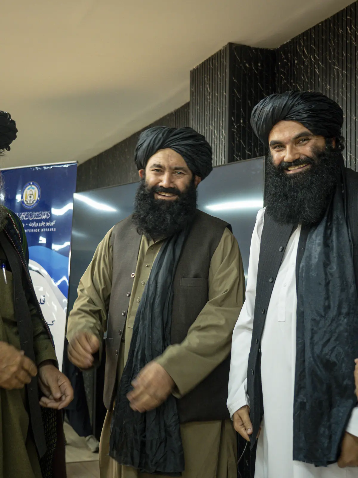 From right to left, Mawlawi Hamdullah Naumani, Minister of Communications and Information Technology, Sirajuddin Haqqani, the Talibans acting Interior Minister, Mullah Mohammad Younis Akhundzada, Minister of Rural Rehabilitation and Development, and another Taliban official stand on a stage During a ceremony in Kabul, Afghanistan on December 28, 2025. The ceremony honors Kabul Mayor Mawlawi Abdul Rashid Baluch for his work on urban development projects in the capital. Organized by the Talibans acting Interior Minister Sirajuddin Haqqani, the event is attended by several senior officials and cabinet members. Baluch is awarded a certificate of appreciation, and a traditional Afghan turban is placed on his head as a symbolic gesture of respect at the conclusion of the ceremony.//MIDDLEEASTIMAGES_mei0777/Credit:Javid Ashna/MEI/SIPA/2512300912