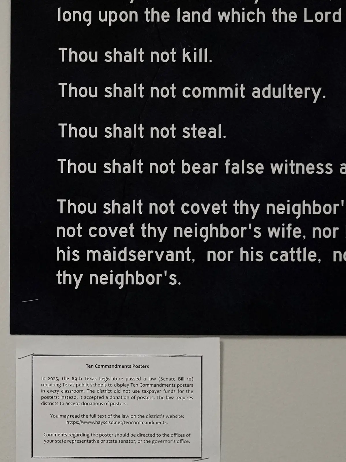 FILE - A Ten Commandments poster and explanation of the state's new law are displayed in a classroom at Lehman High School in Kyle, Texas, Thursday, Oct. 16, 2025. (AP Photo/Eric Gay,File)