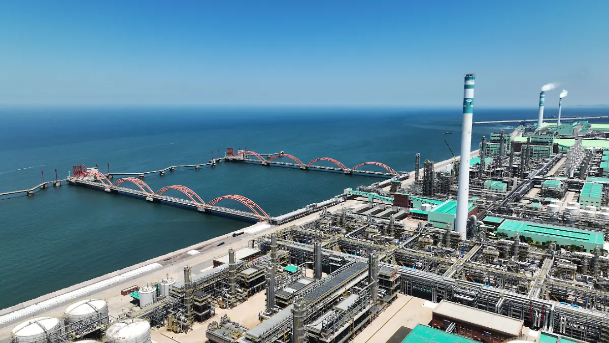 (240810) -- SHENYANG, Aug. 10, 2024 (Xinhua) -- An aerial drone photo taken on June 16, 2024 shows a view of a petrochemical industrial park of Hengli Group on Changxing Island of Dalian, northeast China's Liaoning Province. The petrochemical industry, as a pillar industry of the country's northeastern provinces, has optimized industrial structure in recent years to promote high-quality development. (Xinhua/Yang Qing)