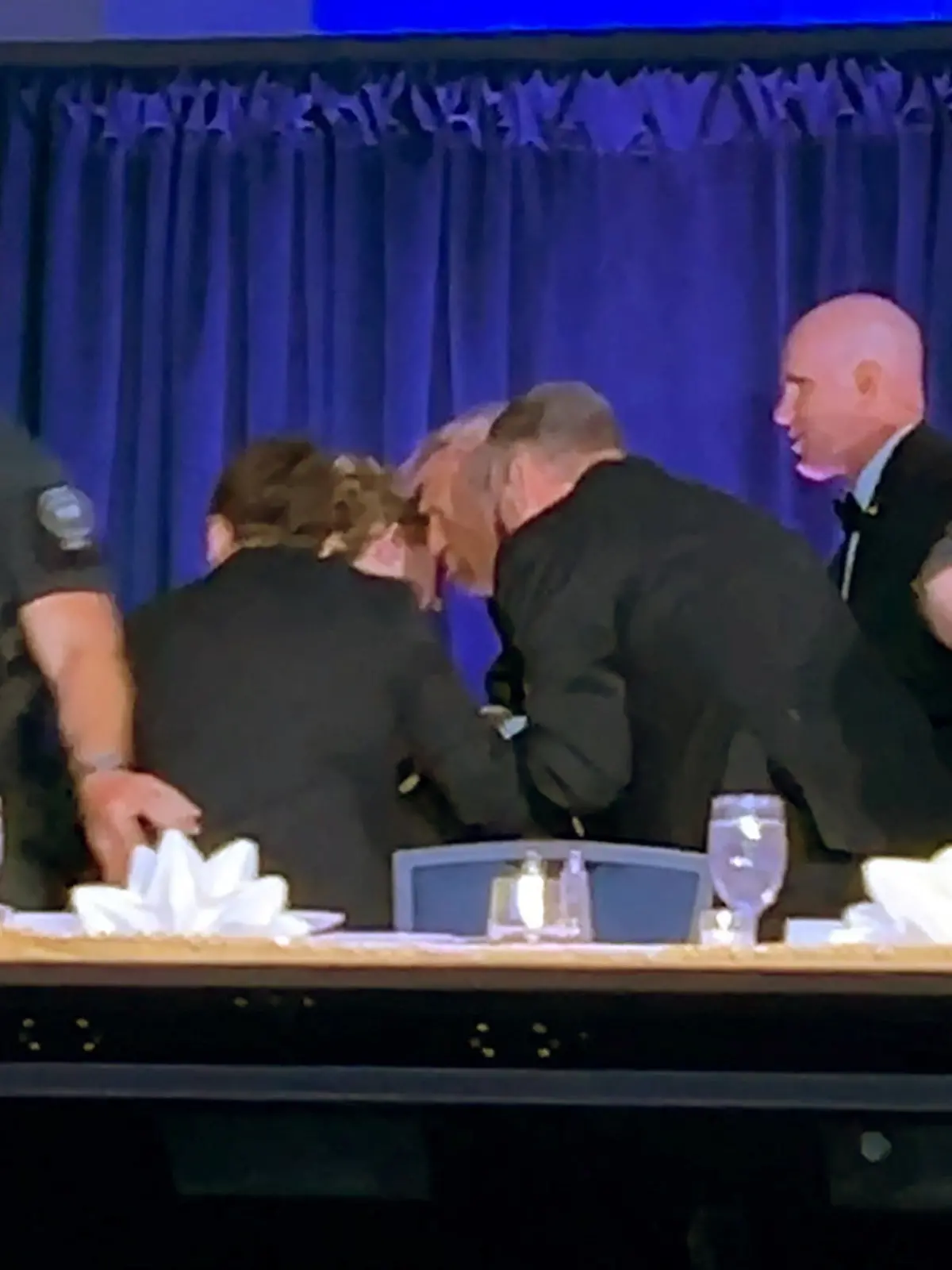 U.S. President Donald Trump is escorted out after a man opened fire with a shotgun on security personnel outside the room, during the annual White House Correspondents' Association dinner in Washington, D.C., U.S., April 25, 2026, in this still image from video. REUTERS/Bo Erickson THIS IMAGE WAS PROCESSED BY REUTERS TO ENHANCE QUALITY, AN UNPROCESSED VERSION HAS BEEN PROVIDED SEPARATELY.