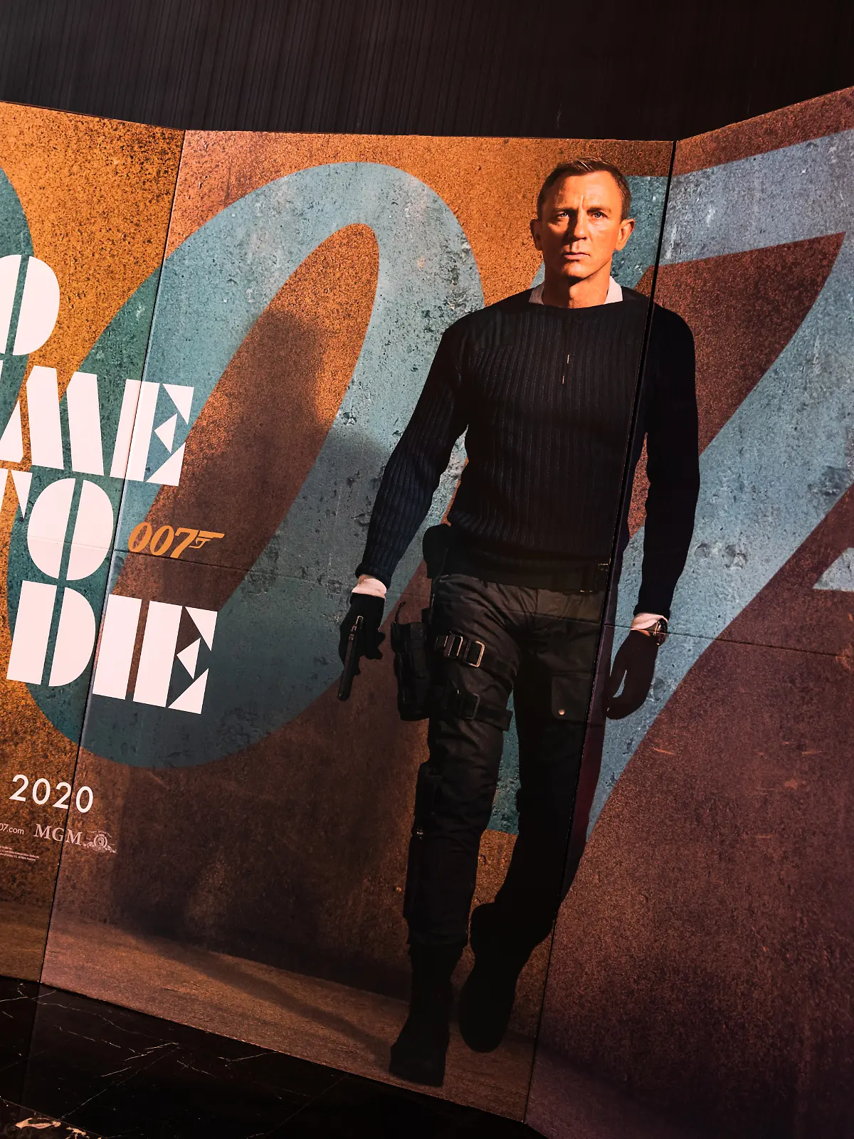 Bangkok, Thailand - Dec 20, 2019: James Bond 007 No Time To Die movies advertising on backdrop poster standee in cinema theatre. Movie advertisement or film entertainment industry concept