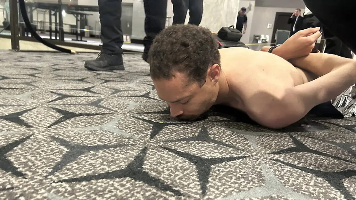 Cole Tomas Allen, 31, from Torrance, Calif., is tackled and arrested by the U.S. Secret Service after he rushed the ballroom doors of the Washington Hilton with a shotgun during the Washington Press Association Correspondents Dinner in Washington, DC, on Saturday, April 25, 2026. Photo posted by President Trump on Truth Social. PUBLICATIONxNOTxINxUSA WAX2026042601 official