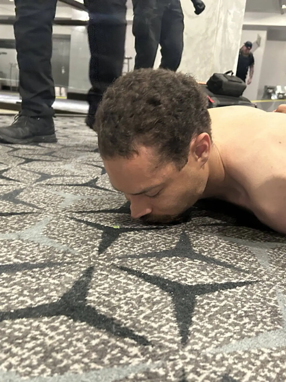 Cole Tomas Allen, 31, from Torrance, Calif., is tackled and arrested by the U.S. Secret Service after he rushed the ballroom doors of the Washington Hilton with a shotgun during the Washington Press Association Correspondents Dinner in Washington, DC, on Saturday, April 25, 2026. Photo posted by President Trump on Truth Social. PUBLICATIONxNOTxINxUSA WAX2026042601 official
