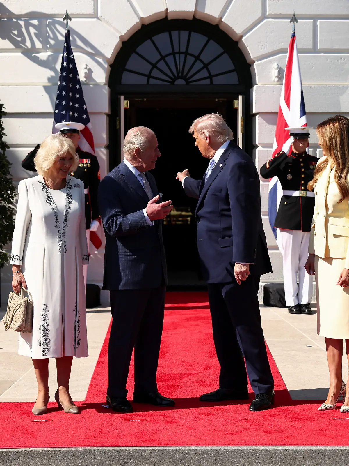 U.S. President Donald Trump and first lady Melania Trump receive Britain's King Charles and Queen Camilla for afternoon tea on the South Lawn of the White House in Washington, D.C., U.S., April 27, 2026. REUTERS/Kevin Lamarque