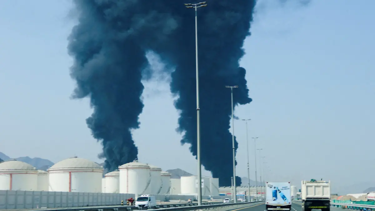 FILE PHOTO: Smoke rises in the Fujairah oil industry zone, caused by debris after interception of a drone by air defenses, according to the Fujairah media office, amid the U.S.-Israel conflict with Iran, in Fujairah, United Arab Emirates, March 14, 2026. REUTERS/Staff/File Photo