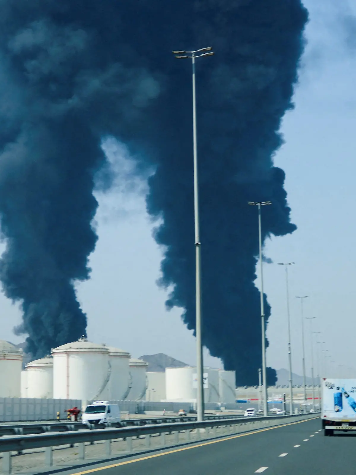 FILE PHOTO: Smoke rises in the Fujairah oil industry zone, caused by debris after interception of a drone by air defenses, according to the Fujairah media office, amid the U.S.-Israel conflict with Iran, in Fujairah, United Arab Emirates, March 14, 2026. REUTERS/Staff/File Photo
