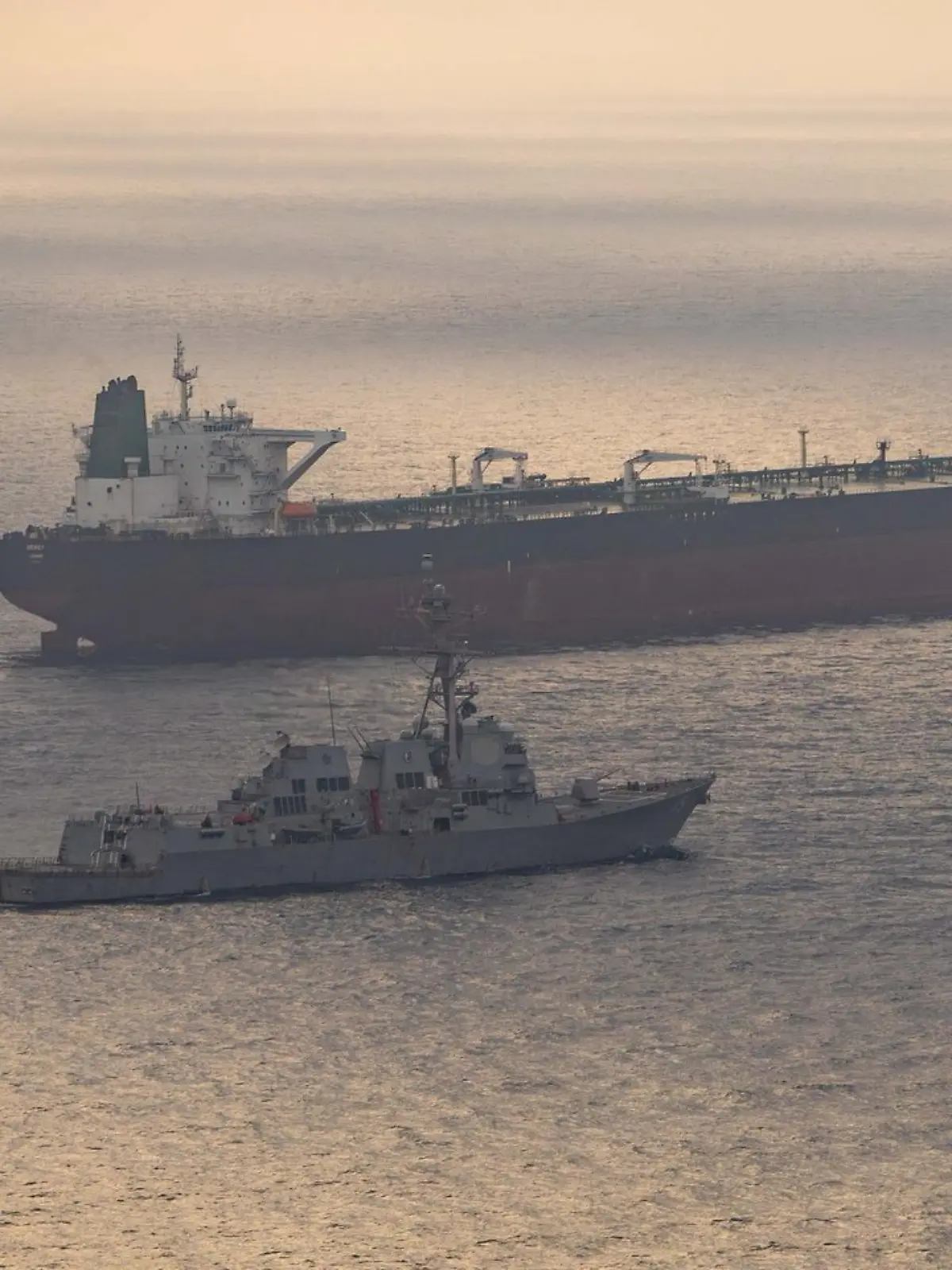 USS Rafael Peralta (DDG 115) near what the U.S. Central Command said was a vessel attempting to sail to an Iranian port, as it enforces the U.S. blockade on Iranian ports, at an unknown location, released April 24, 2026.   U.S. Central Command/Handout via REUTERS    THIS IMAGE HAS BEEN SUPPLIED BY A THIRD PARTY. MANDATORY CREDIT.  Verification Lines:  Reuters was able to identify Guided-missile destroyer USS Rafael Peralta (DDG 115) from the deck layout, mast, and superstructure of the vessel that matched file images Location and date could not be verified No earlier versions of the image were found posted online before April 24