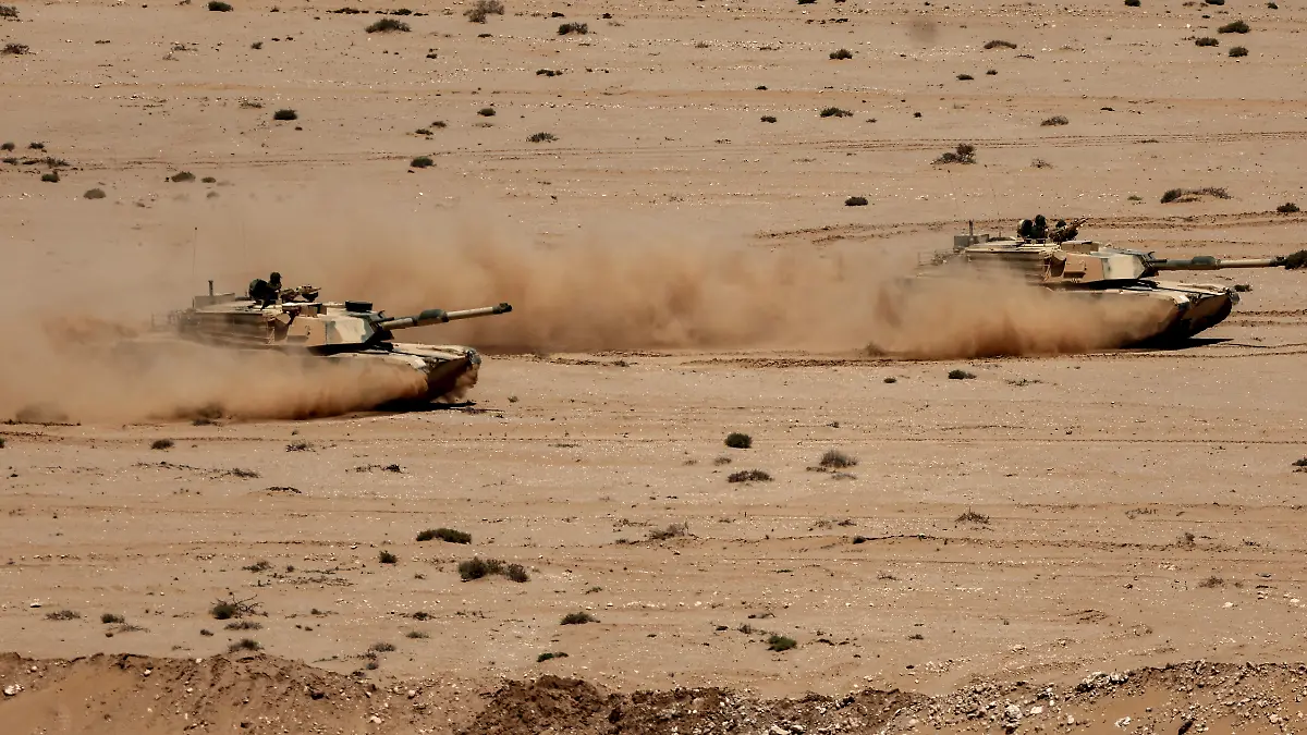 Battle tanks drive in formation during the "African Lion" joint military exercise between US and Moroccan forces in the Tan-Tan region in southwestern Morocco on May 8, 2026. (Photo by Abdel Majid BZIOUAT / AFP)