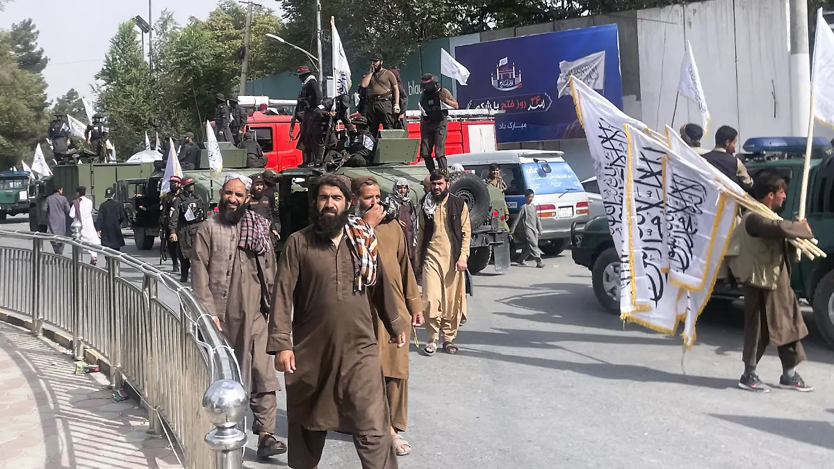 Taliban security officers and supporters celebrate the fourth anniversary of the group's return to power in Kabul on Aug. 15, 2025. (Kyodo)
