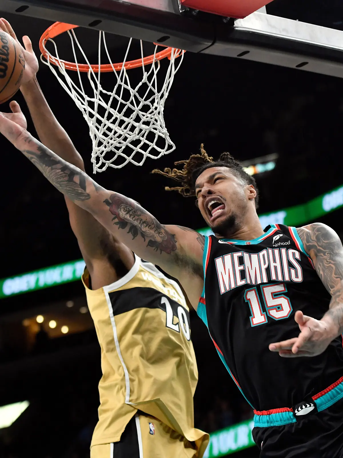 FILE - Memphis Grizzlies forward Brandon Clarke (15) shoots against Washington Wizards center Alex Sarr (20) in the first half of an NBA basketball game, Dec. 20, 2025, in Memphis, Tenn. (AP Photo/Brandon Dill)
