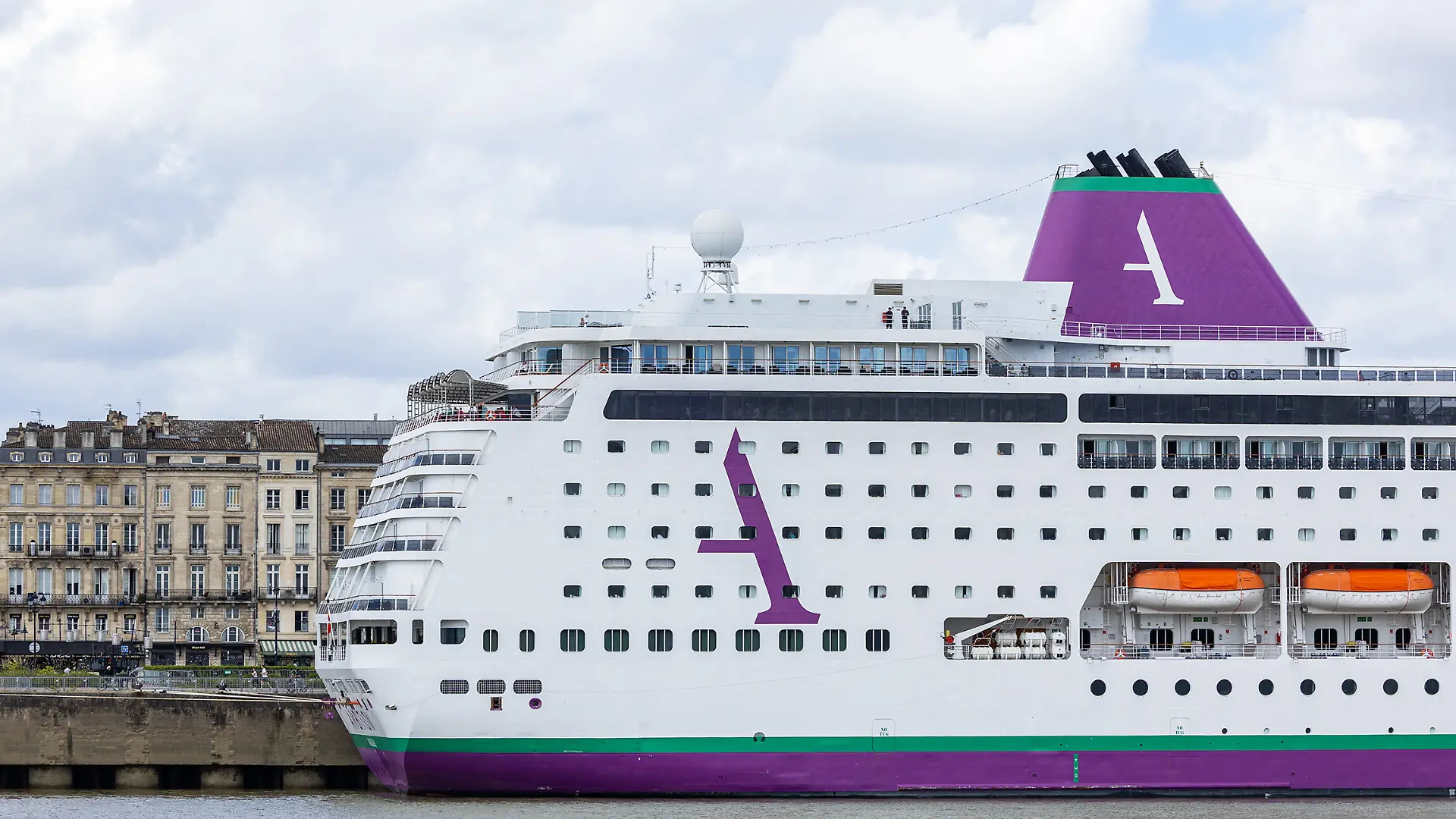 Passengers aboard the Bahamas-registered cruise ship Ambition Ambassador confined following the outbreak of a gastrointestinal illness onboard, at the Bordeaux port in Bordeaux, southwestern France on May 13, 2026. French authorities on May 13 confined more than 1,700 passengers and crew on a British cruise ship docked in Bordeaux after an elderly passenger died, said officials, who played down any links to the hantavirus scare. Photo by Margot Le Gonidec/ABACAPRESS.COM