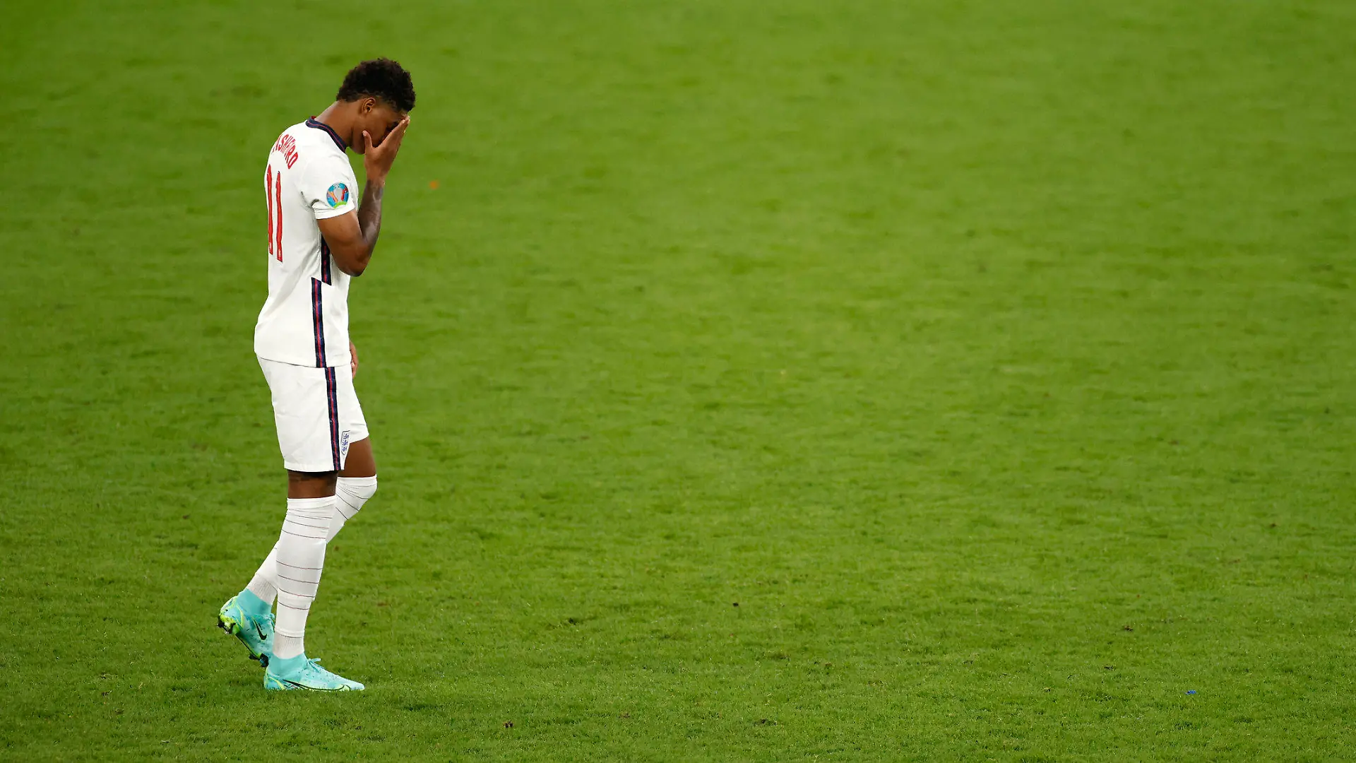 England's Marcus Rashford reacts after missing a penalty in a shootout against Italy at the Euro 2020 soccer championship final at Wembley stadium in London, Sunday, July 11, 2021. (John Sibley/Pool Photo via AP)