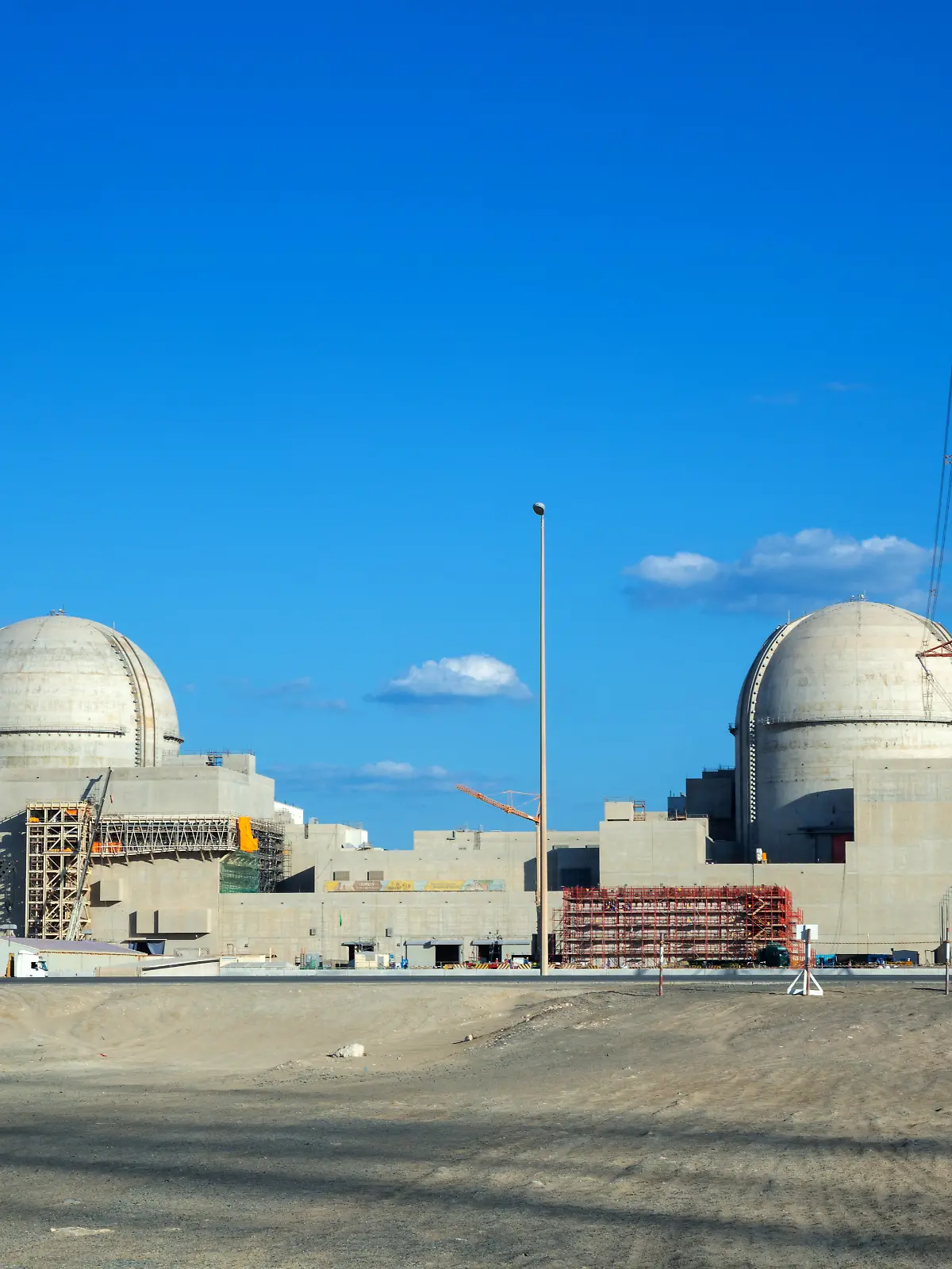 (FILES) A handout picture obtained from the media office of the Barakah Nuclear Power Plant on February 13, 2020, shows a view of the power plant in the western Al Dhafra Region -formerly know as the Gharbiya region- of Abu Dhabi on the Gulf coastline about 50 kilometres west of Ruwais. A fire broke out following a drone strike on a nuclear power plant in the emirate of Abu Dhabi on May 17, 2026, authorities said, reporting no injuries or impact on radiation levels. "Authorities in Abu Dhabi responded to a fire incident that broke out in an electrical generator outside the inner perimeter of the Barakah Nuclear Power Plant in the Al Dhafra Region, caused by a drone strike," the Abu Dhabi Media Office wrote in a social media post. (Photo by Barakah Nuclear Power Plant / AFP) / RESTRICTED TO EDITORIAL USE - MANDATORY CREDIT "AFP PHOTO /Barakah Nuclear Power Plant" - NO MARKETING - NO ADVERTISING CAMPAIGNS - DISTRIBUTED AS A SERVICE TO CLIENTS