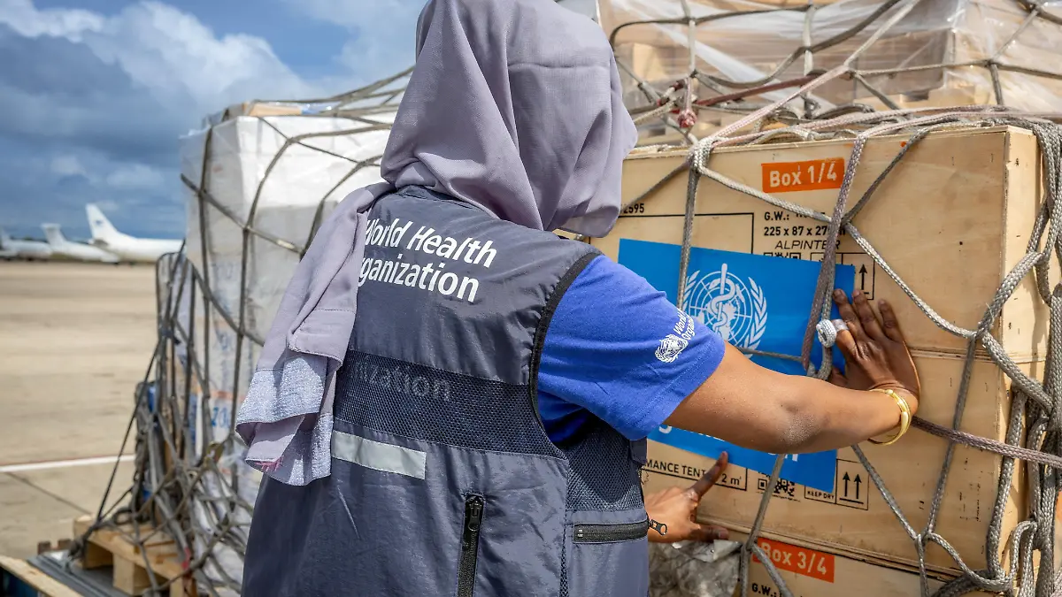 Fatima Tafida, the Regional Supply Chain Lead for Emergencies at the World Health Organization's (WHO) Regional Office for Africa pastes stickers on shipment pallets as the WHO mobilise 4.7 tonnes of essential medical supplies and emergency kits to support the affected regions in response to the Ebola outbreak in the Democratic Republic of Congo from the Jomo Kenyatta International Airport (JKIA) in Nairobi, Kenya May 18, 2026. World Health Organization/Handout via REUTERS THIS IMAGE HAS BEEN SUPPLIED BY A THIRD PARTY