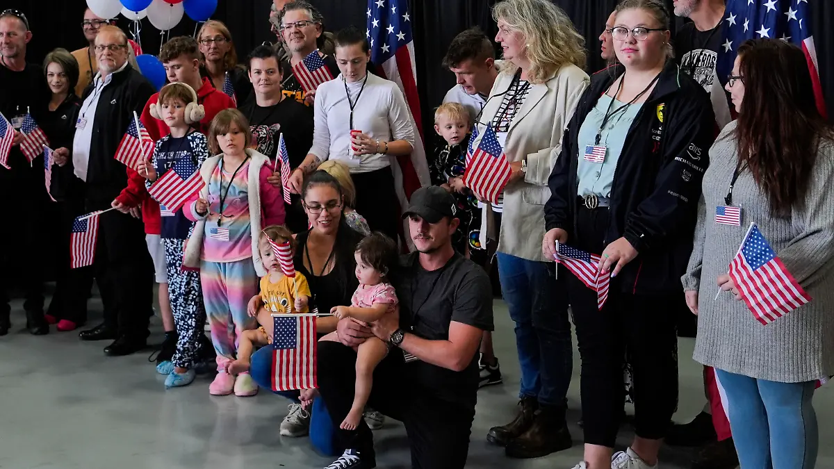 Afrikaner refugees from South Africa arrive, Monday, May 12, 2025, at Dulles International Airport in Dulles, Va. (AP Photo/Julia Demaree Nikhinson)
