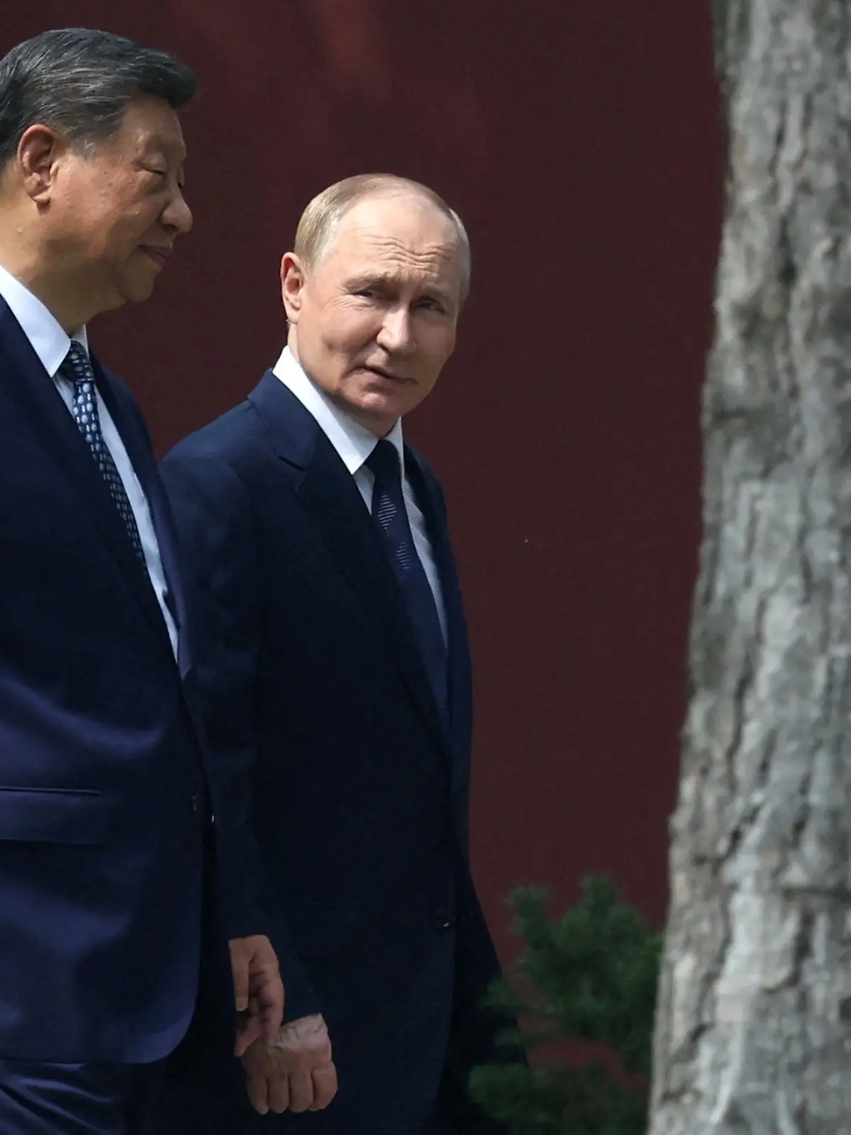FILE PHOTO: Chinese President Xi Jinping and Russian President Vladimir Putin walk at the personal residence of the Chinese leader Zhongnanhai in Beijing, China September 2, 2025. Sputnik/Alexander Kazakov/Pool via REUTERS ATTENTION EDITORS - THIS IMAGE WAS PROVIDED BY A THIRD PARTY./File Photo