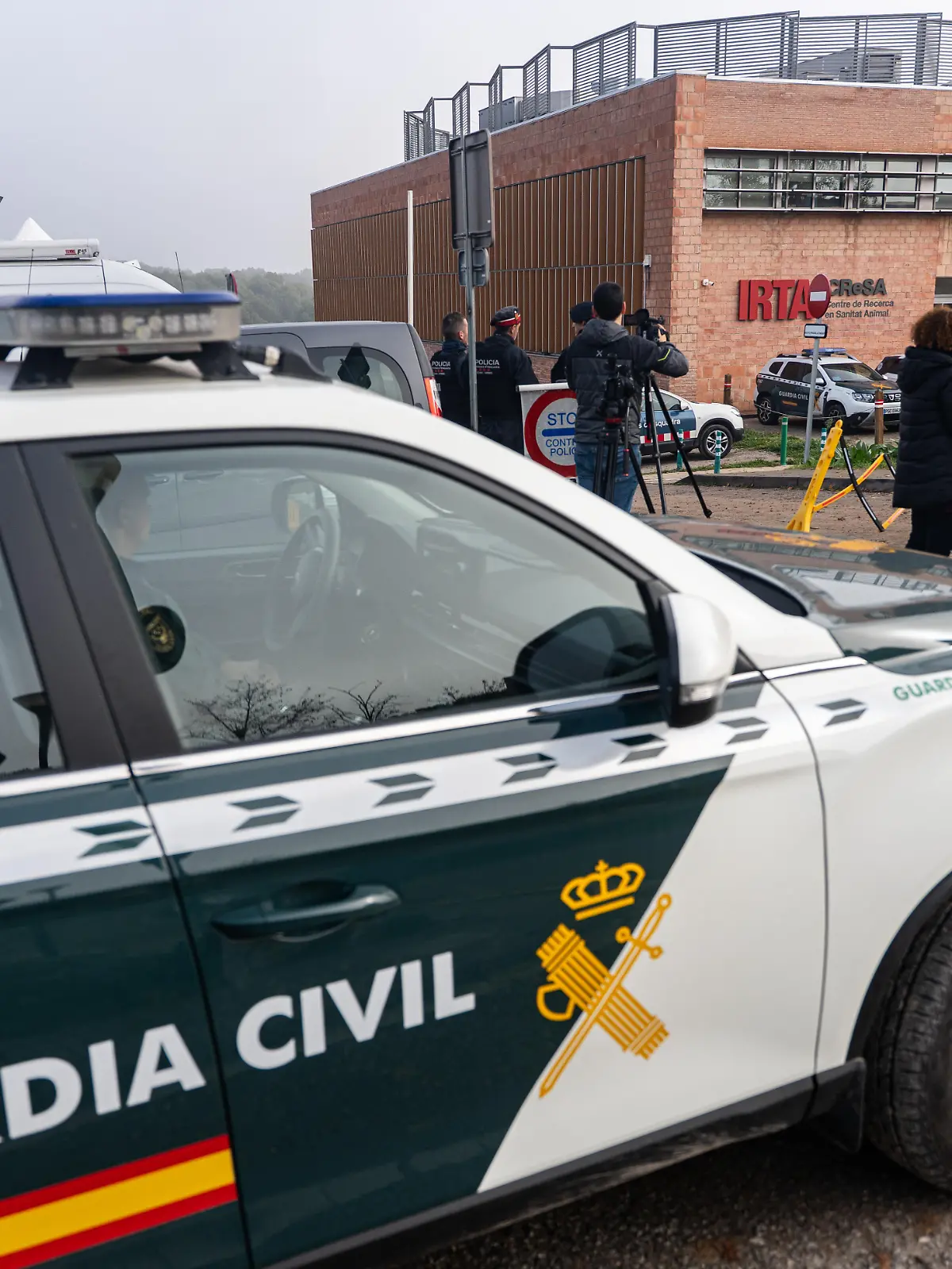 The Mossos d'Esquadra (Catalan police) and the Guardia Civil (Spanish Civil Guard) conduct an investigation at the IRTA-CRESA laboratory in Cerdanyola del Valles, Spain, on December 18, 2025, into African swine fever. The first positive cases of African swine fever in wild boar are found very close to the laboratory, and the main hypothesis is that the virus may have originated there. (Photo by Marc Asensio/NurPhoto)