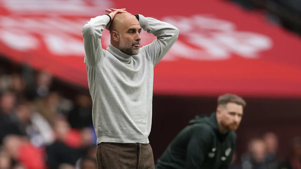 Manchester City's head coach Pep Guardiola reacts during the English FA Cup final soccer match between Chelsea and Manchester City in London, Saturday, May 16, 2026. (AP Photo/Richard Pelham)