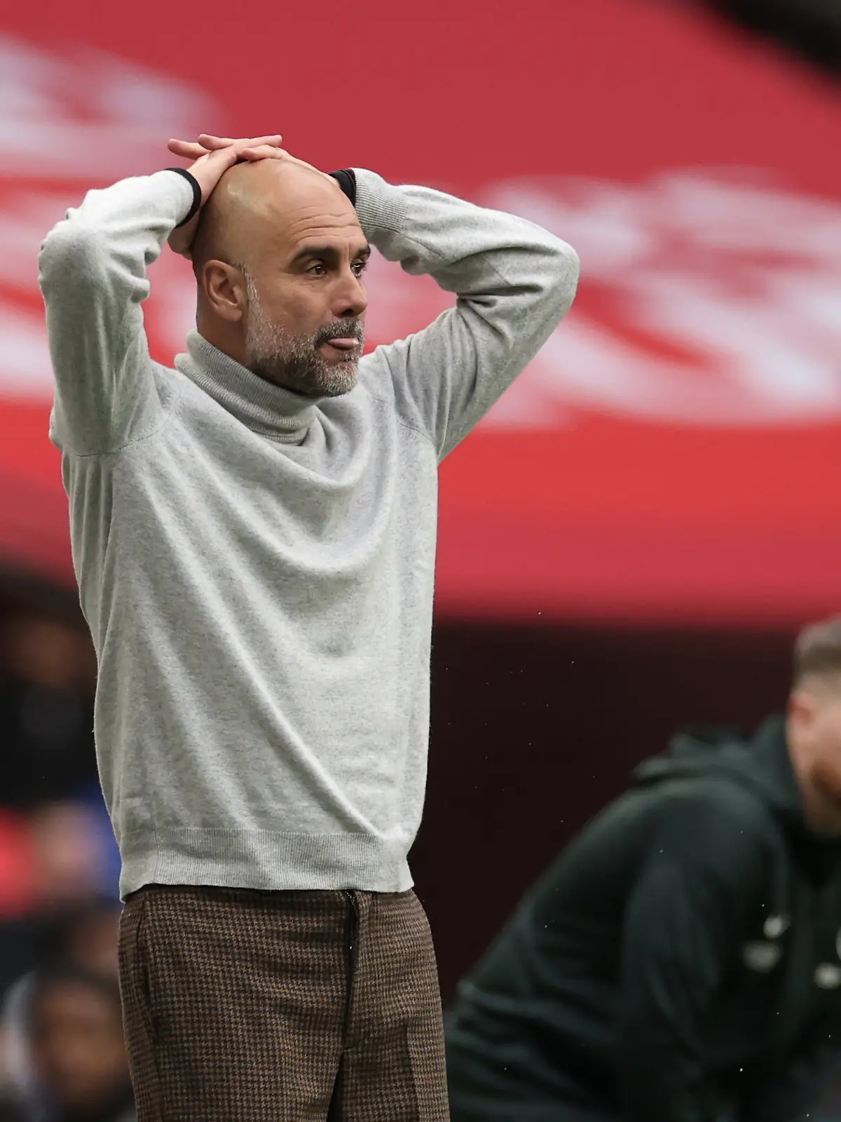Manchester City's head coach Pep Guardiola reacts during the English FA Cup final soccer match between Chelsea and Manchester City in London, Saturday, May 16, 2026. (AP Photo/Richard Pelham)