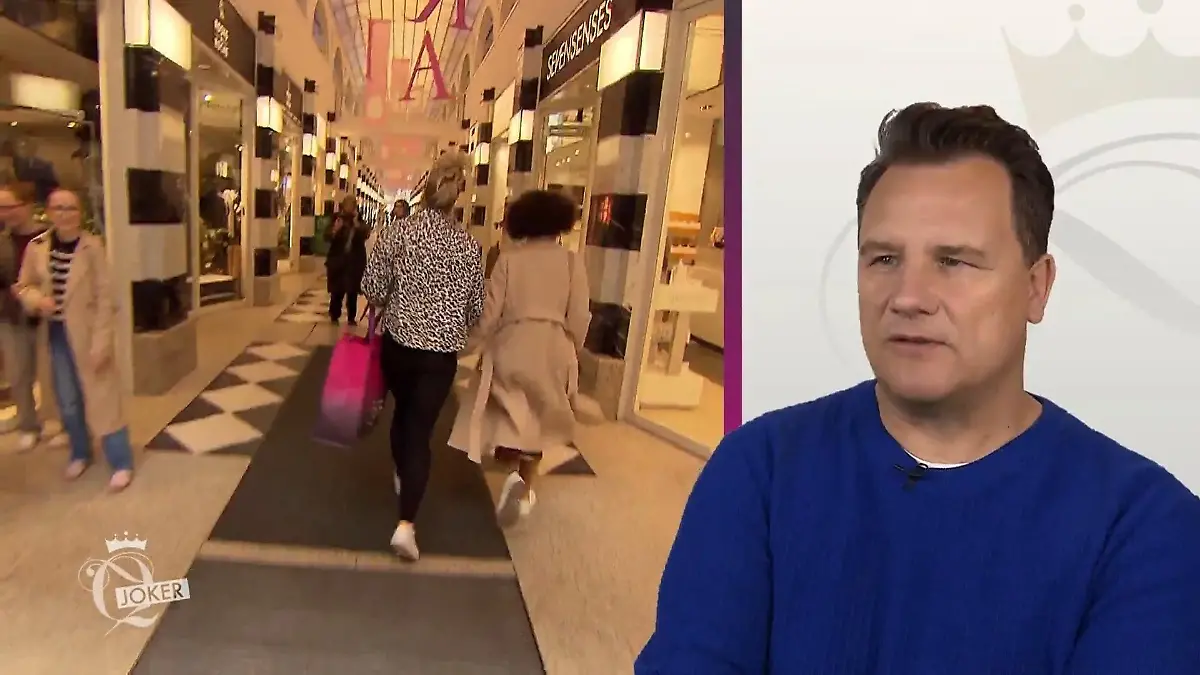 Janika und ihre Begleitung eilen durch eine helle Passage.