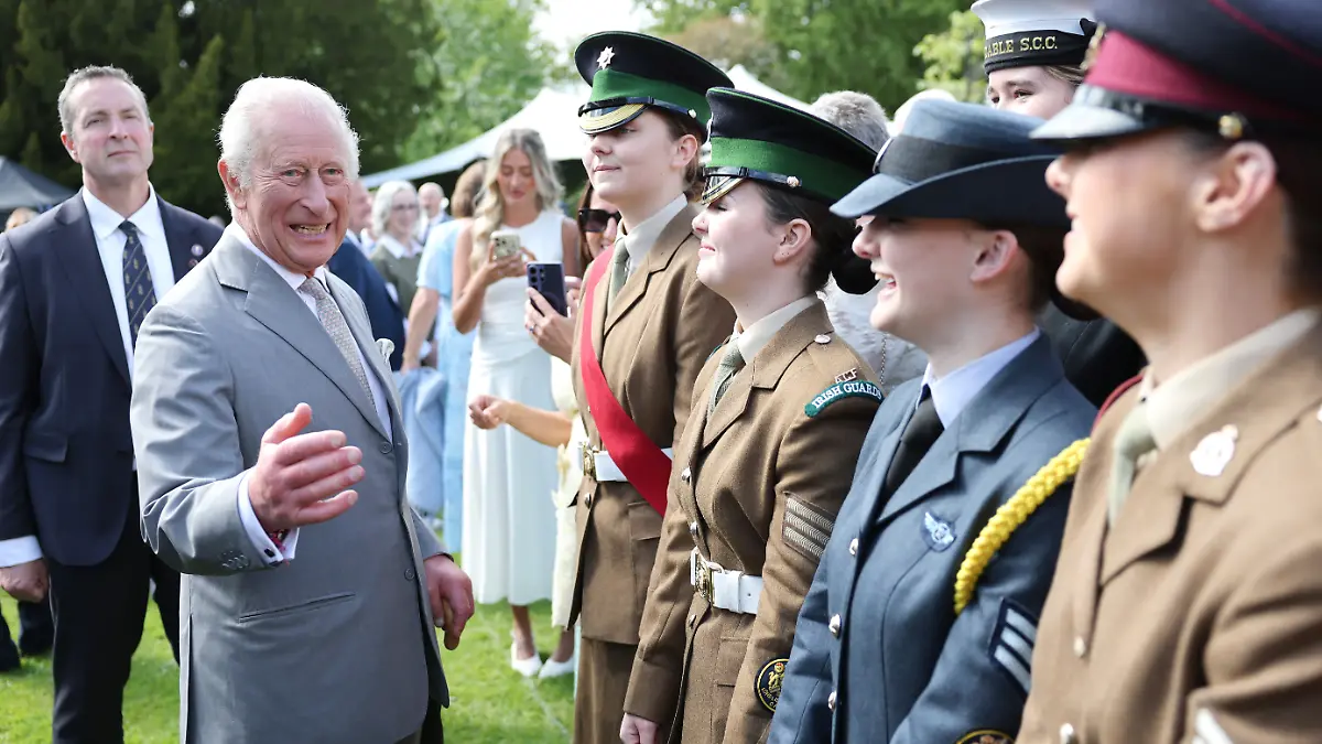 Royal visit to Northern Ireland. King Charles III laughs as he speaks with military personnel during a Royal Garden Party at Hillsborough Castle, on day two of the royal visit to Northern Ireland. Picture date: Wednesday May 20, 2026. Photo credit should read: Chris Jackson/PA Wire URN:84689271