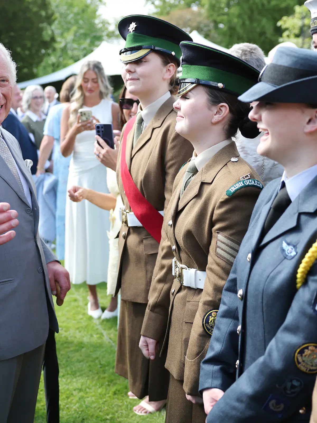 Royal visit to Northern Ireland. King Charles III laughs as he speaks with military personnel during a Royal Garden Party at Hillsborough Castle, on day two of the royal visit to Northern Ireland. Picture date: Wednesday May 20, 2026. Photo credit should read: Chris Jackson/PA Wire URN:84689271