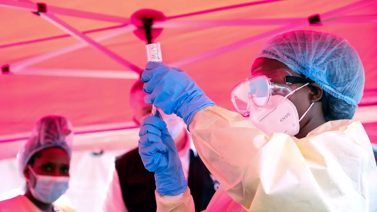 A health worker prepares to administer a vial of a vaccine against the Sudan strain of Ebola, during a trial, at Mulago Referral Hospital, in Kampala, Uganda Monday, Feb. 3, 2025. (AP Photo/Hajarah Nalwadda)