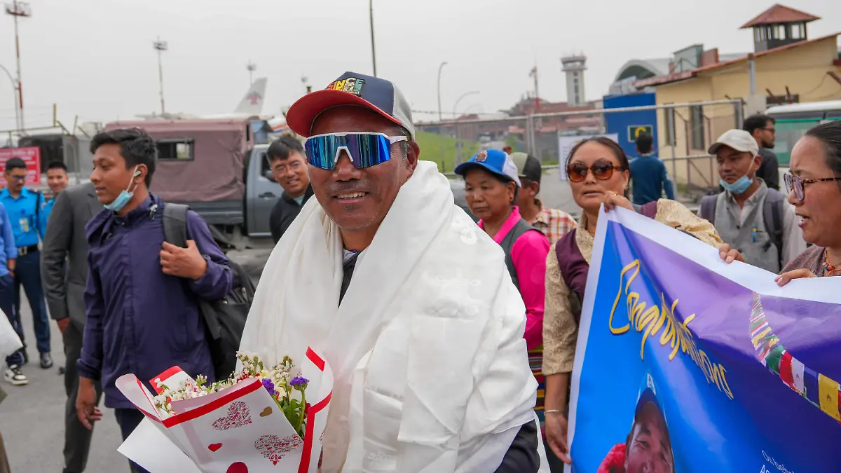 KATHMANDU, NEPAL-MAY 22: Friends and family members welcome Kami Rita Sherpa, 56, upon his arrival at the airport in Kathmandu, Nepal, on May 22, 2026, after the veteran mountaineer and guide set a new record by successfully summiting Mount Everest for the 32nd time. Sunil Pradhan / Anadolu