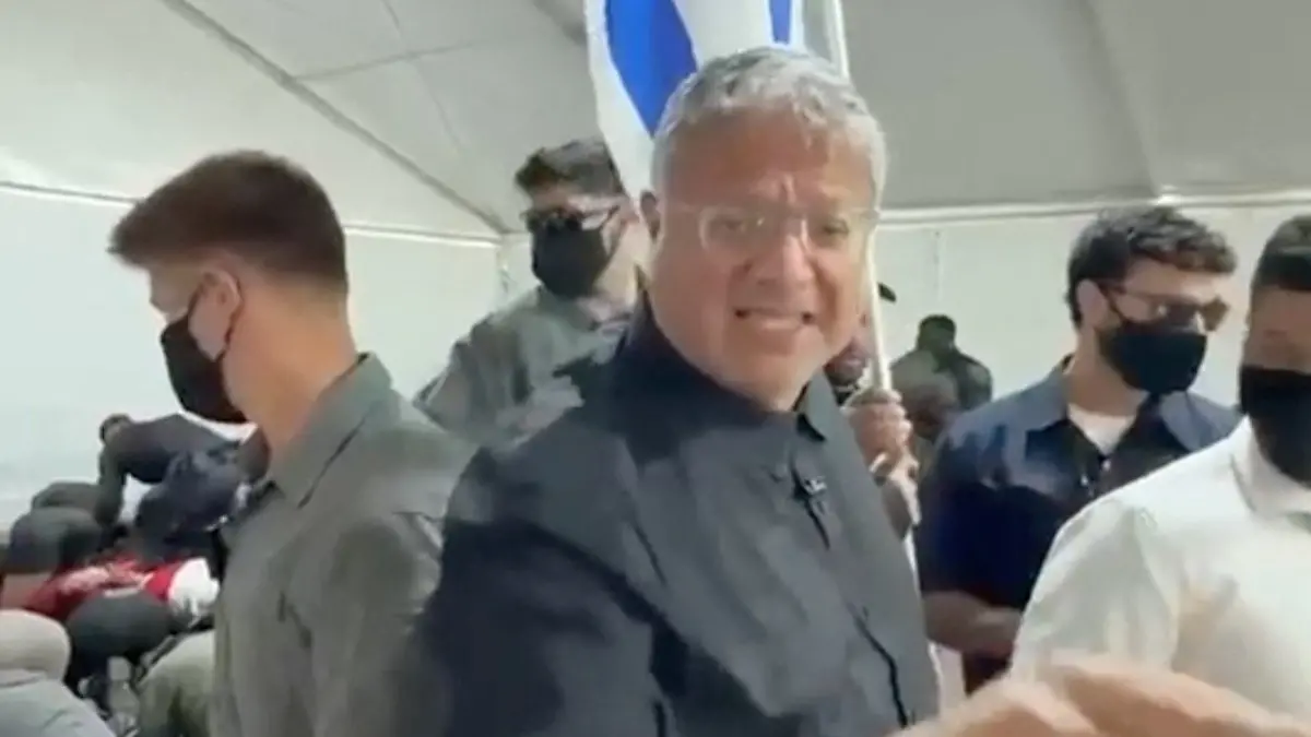 Israeli National Security Minister Itamar Ben Gvir reacts as flotilla activists are detained by Israeli forces, in Ashdod Port, Israel, in this screen grab taken from a video released on May 20, 2026. Office Of Itamar Ben Gvir/Handout via REUTERS THIS IMAGE HAS BEEN SUPPLIED BY A THIRD PARTY MANDATORY CREDIT VERIFICATION LINES: - Deck structure, bridge, stairs and container of the ship seen in video matched Reuters footage of an Israeli vessel arriving in Ashdod port on May 20 and reportedly carrying activists - Buildings and tent structures matched archive imagery of the Ashdod port and corroborating visuals - Identity of all the detained people could not be independently verified; however Reuters confirmed that some of them were part of the Global Sumud Flotilla by hair and facial features which matched visuals posted on social media by the activists - Exact date could not verified, but no older version of the video was found posted online before May 20